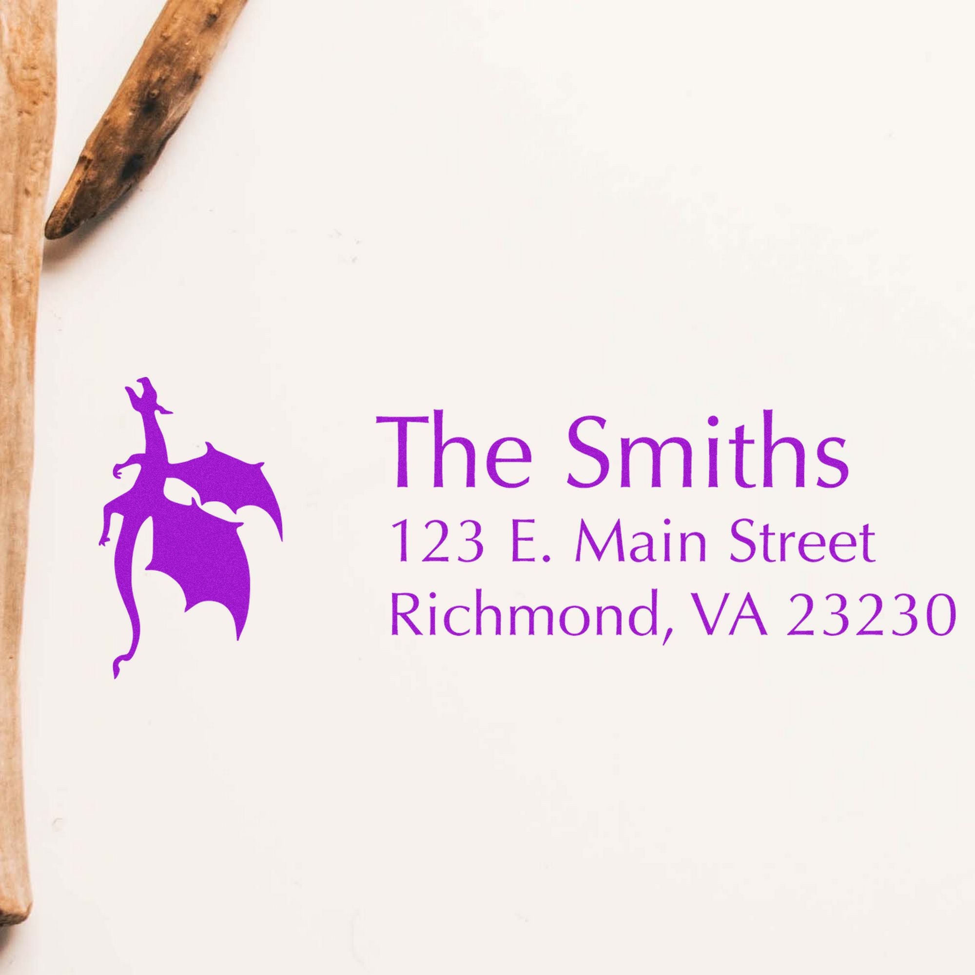 Purple custom stamp and seal with dragon logo, The Smiths, and address on white background.