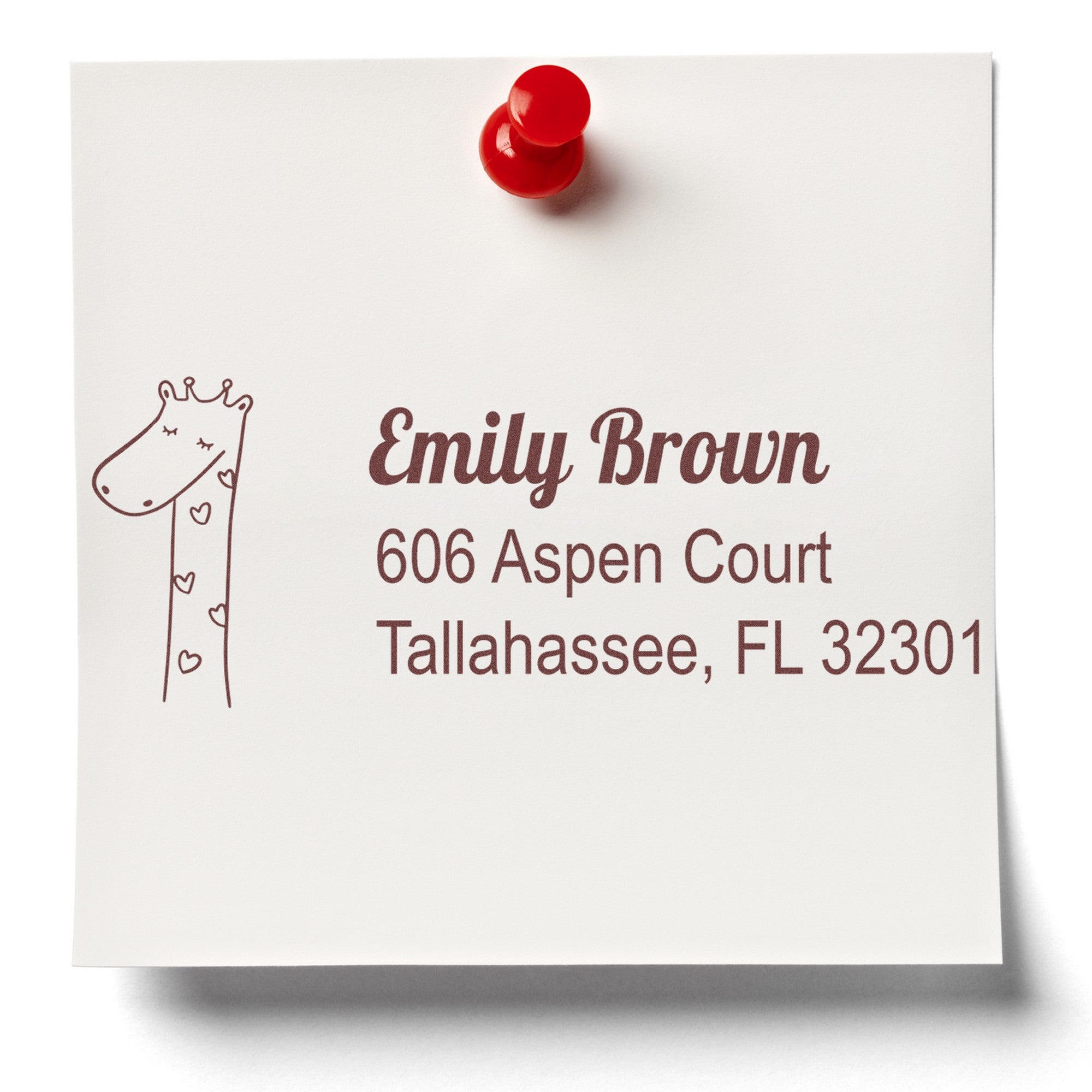 A note pinned with a red pushpin displays a stamped address featuring a lovely giraffe design. The Wood Handle Lovely Giraffe Personalized Mail Address Rubber Stamp is used for this Customized Address Stamp, showing "Emily Brown, 606 Aspen Court, Tallahassee, FL 32301."
