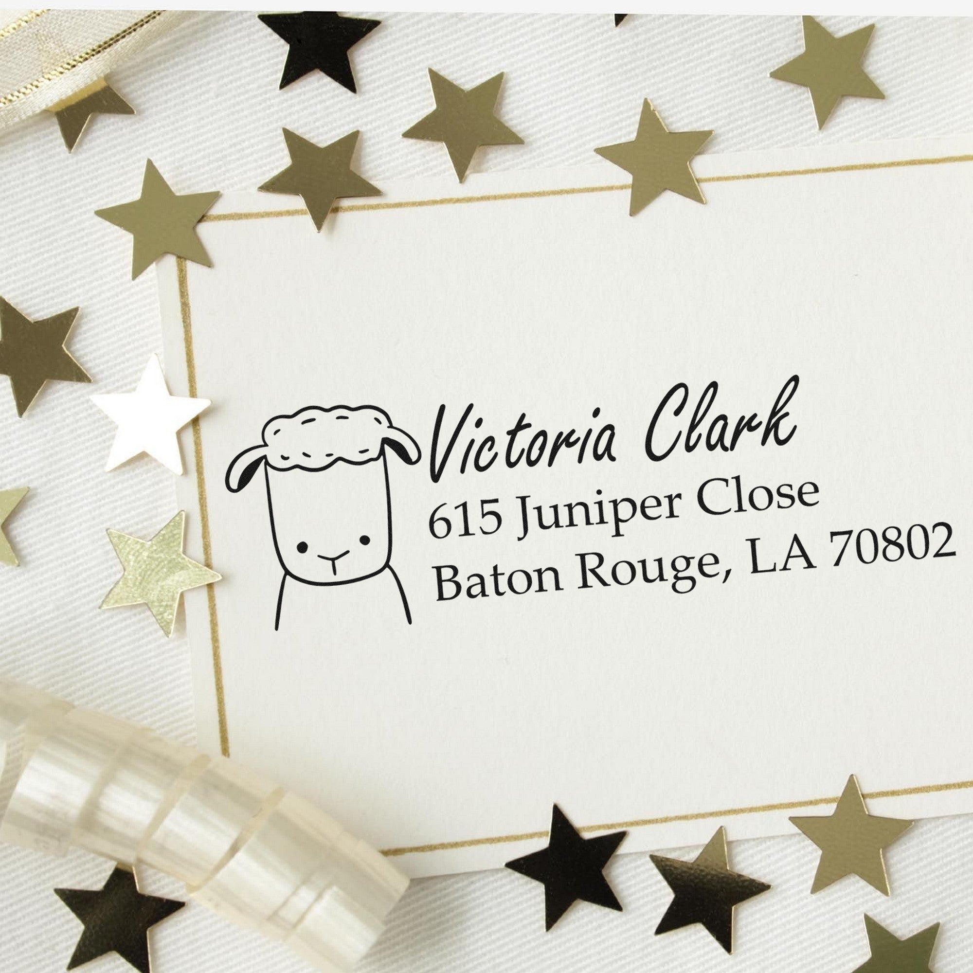 Image of a Customized New Address Stamp featuring a Wood Handle Fluffy Sheep design. The stamp displays the name "Victoria Clark" with an address in Baton Rouge, LA. The background includes gold stars and ribbon, enhancing the elegant presentation.
