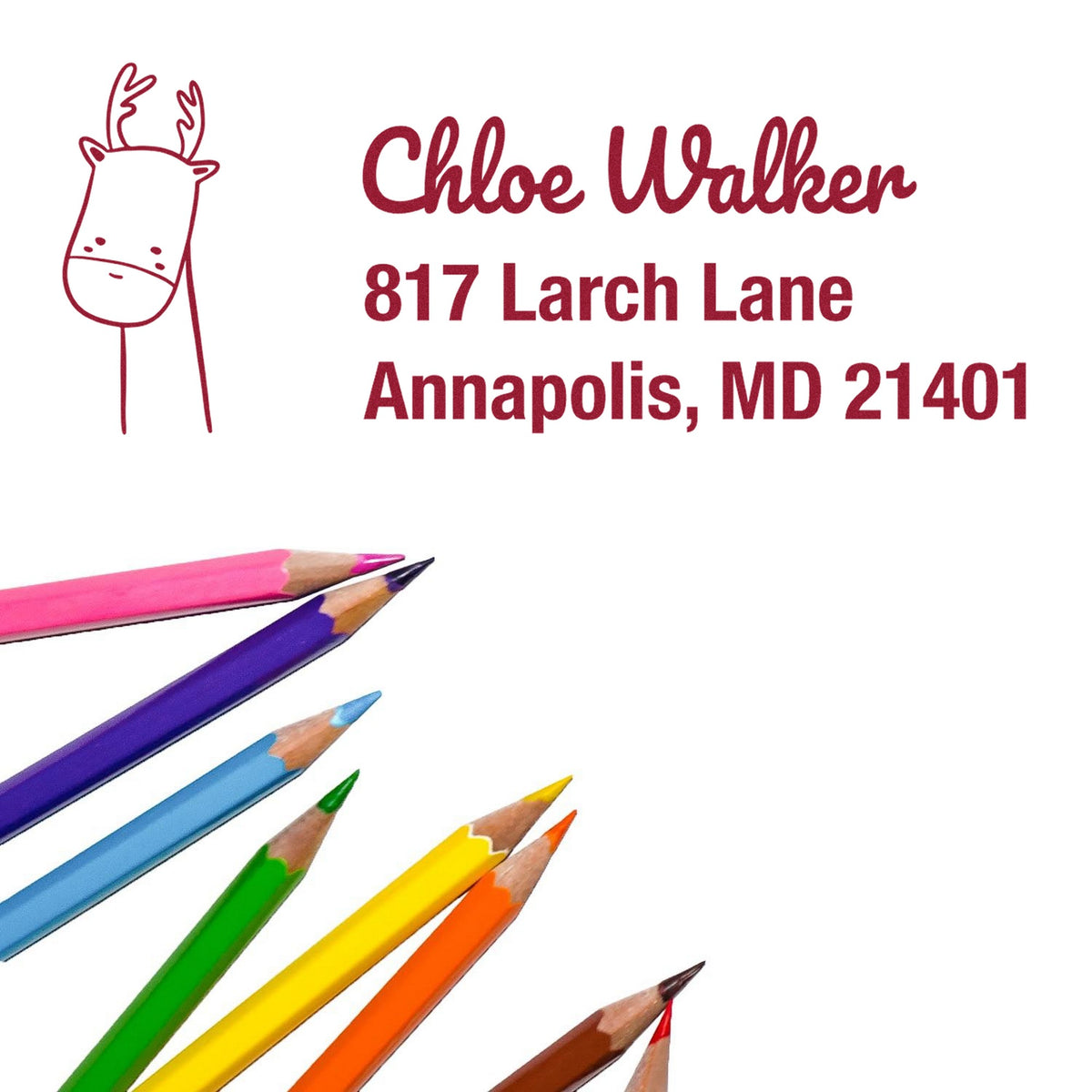 Slim Pre-Inked Regal Reindeer Customized Mail Stamp featuring a reindeer design and personalized return mail stamp with the name Chloe Walker and address in red. Colorful pencils are arranged diagonally at the bottom left.