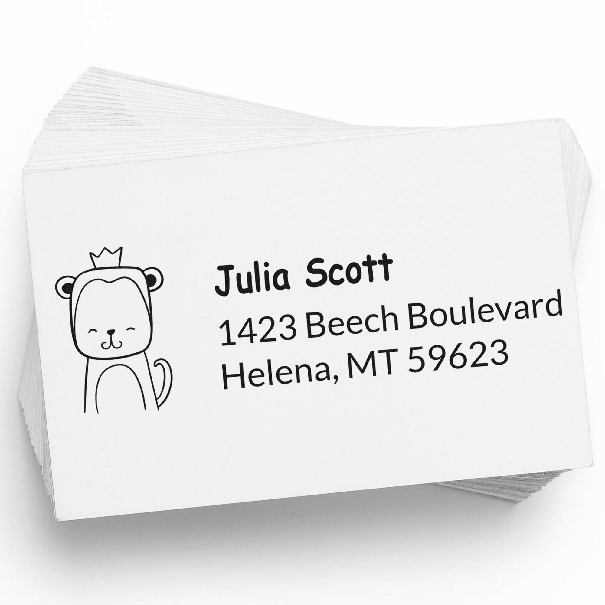 Wood Handle Mischievous Monkey Customized Return Address Rubber Stamp used on a stack of white cards. The design features a playful monkey with a crown, showcasing a Custom-Made Return Mail Stamper with the name Julia Scott and an address in Helena, MT.