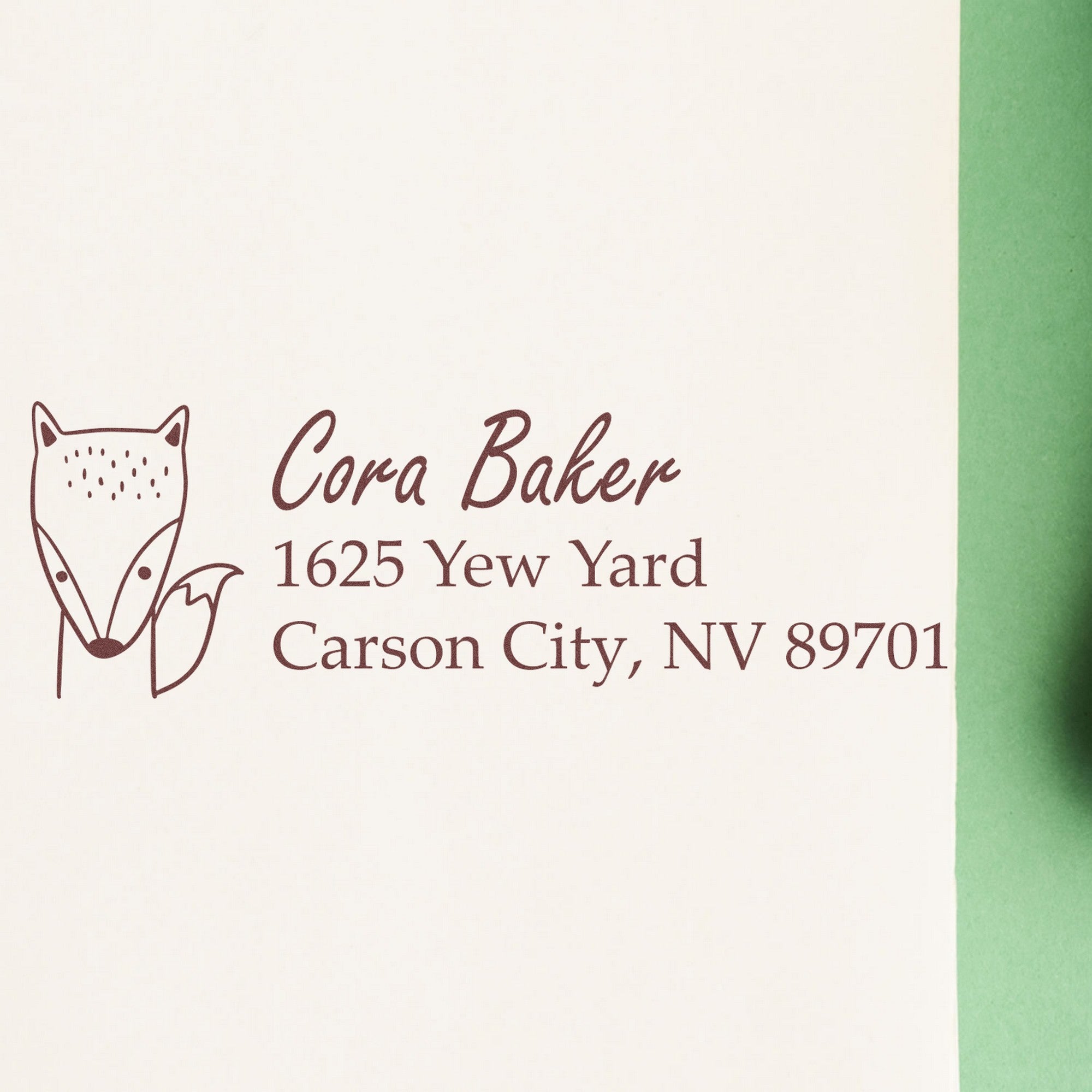 Image of a personalized mailing with a Wood Handle Fast Fox Customized Mailing Rubber Stamp. The stamp features a fox design and the text "Cora Baker, 1625 Yew Yard, Carson City, NV 89701." Ideal for a Personalizable Home Stamp.