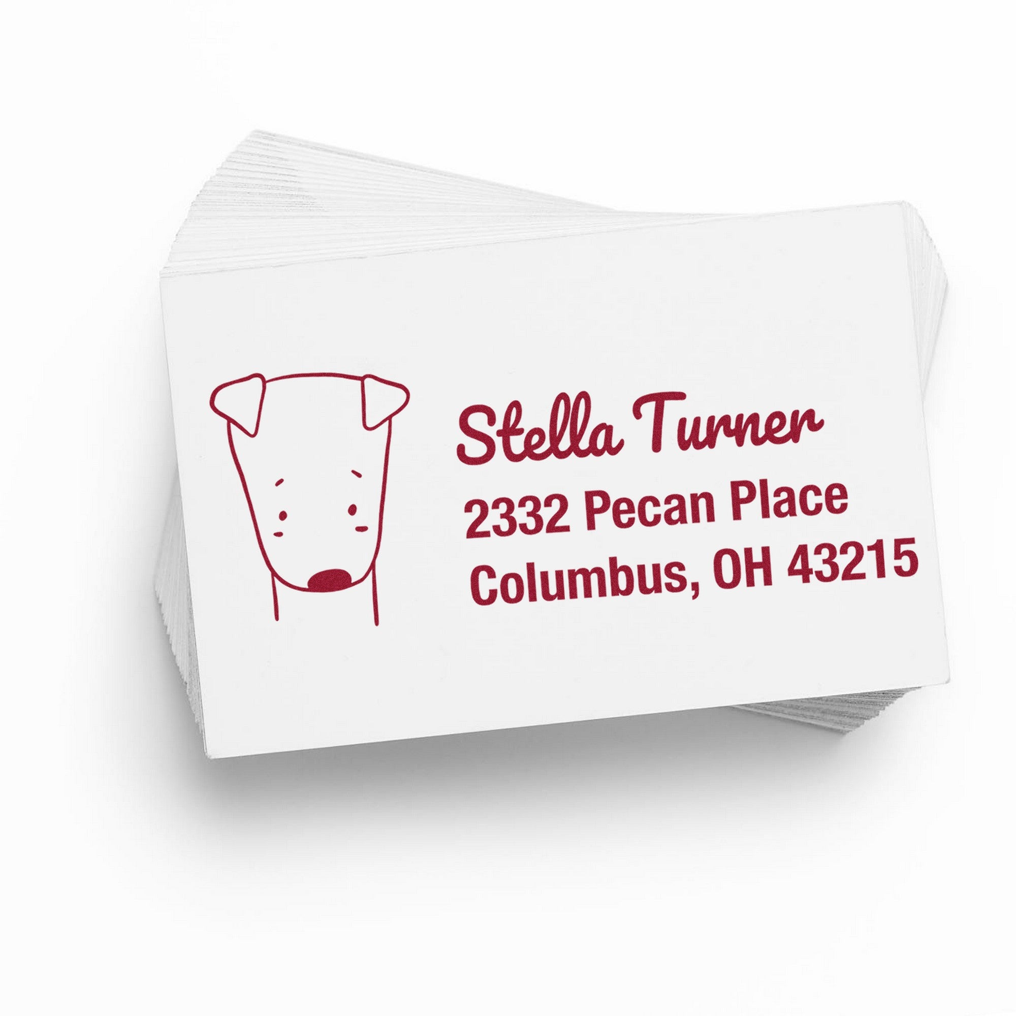 Stack of cards featuring a Slim Pre-Inked Darling Dog Handmade Mailing Address Stamp with a cute dog illustration. The text reads "Stella Turner, 2332 Pecan Place, Columbus, OH 43215." Ideal for a Custom New Address Stamp.