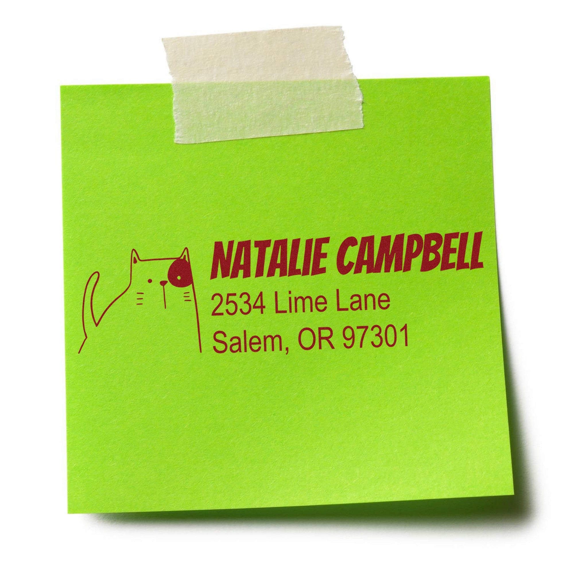Wood Handle Charming Cat Handmade Address Rubber Stamp on a green sticky note with a cat illustration. Text reads "Natalie Campbell, 2534 Lime Lane, Salem, OR 97301." Personalizable New Address Stamper taped at the top.