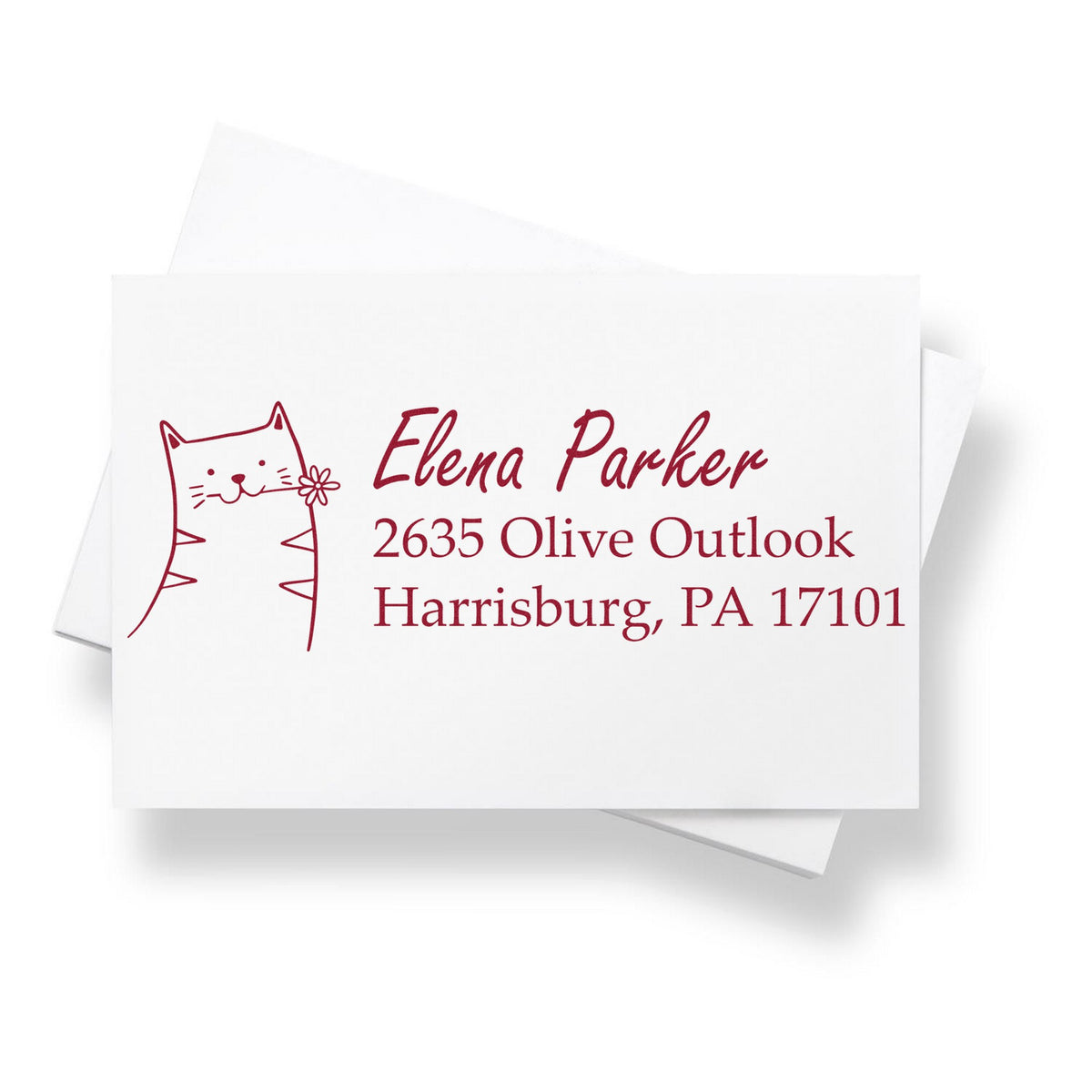 Slim pre-inked fluffy feline handmade home address stamp on an envelope, featuring a cute cat illustration. The customized mailing stamp displays the name "Elena Parker" with an address in Harrisburg, PA.