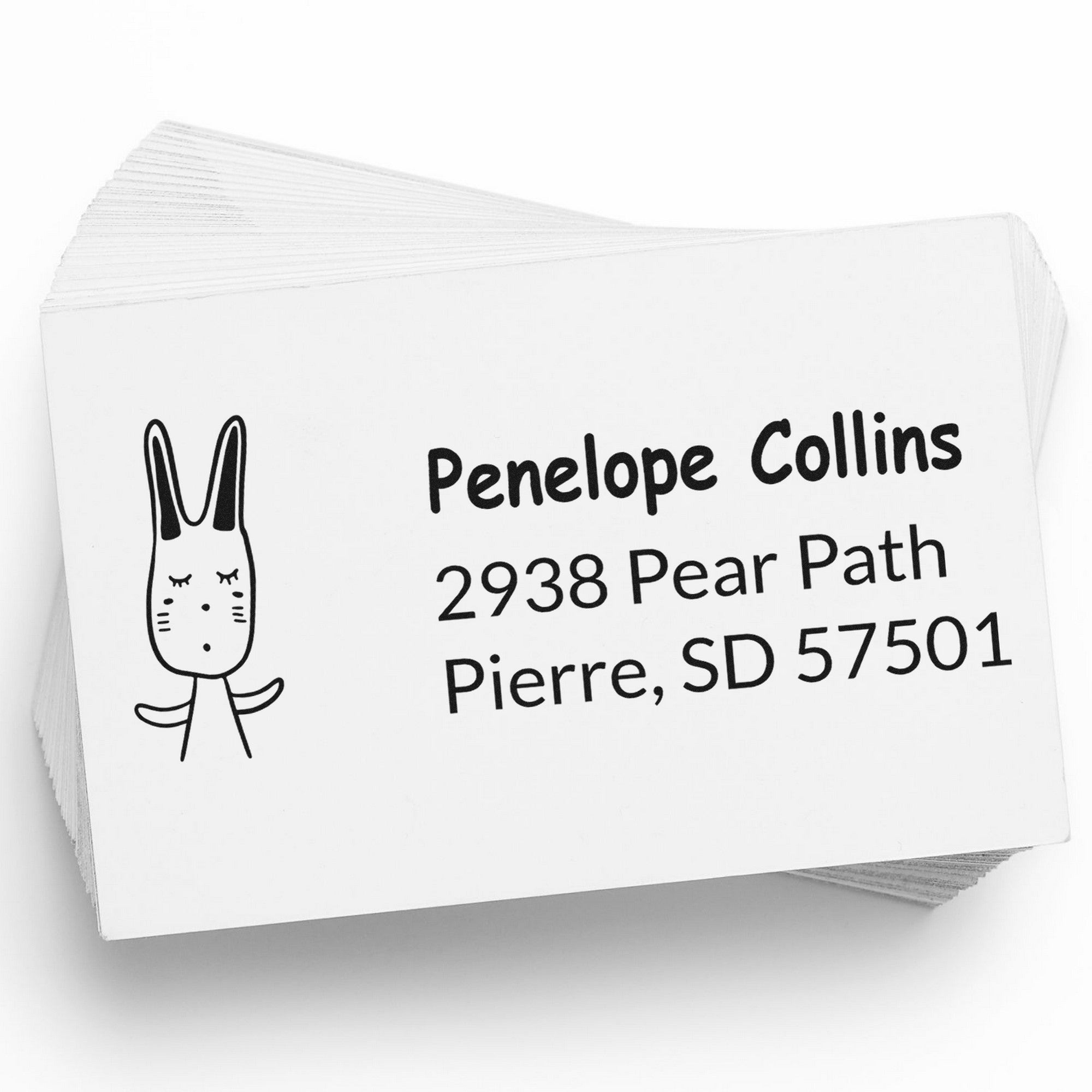 Image of a stack of cards featuring a Wood Handle Bouncy Bunny Handmade Mail Rubber Stamp design. The card displays a Custom New Address Stamper with the name "Penelope Collins" and an address in Pierre, SD.