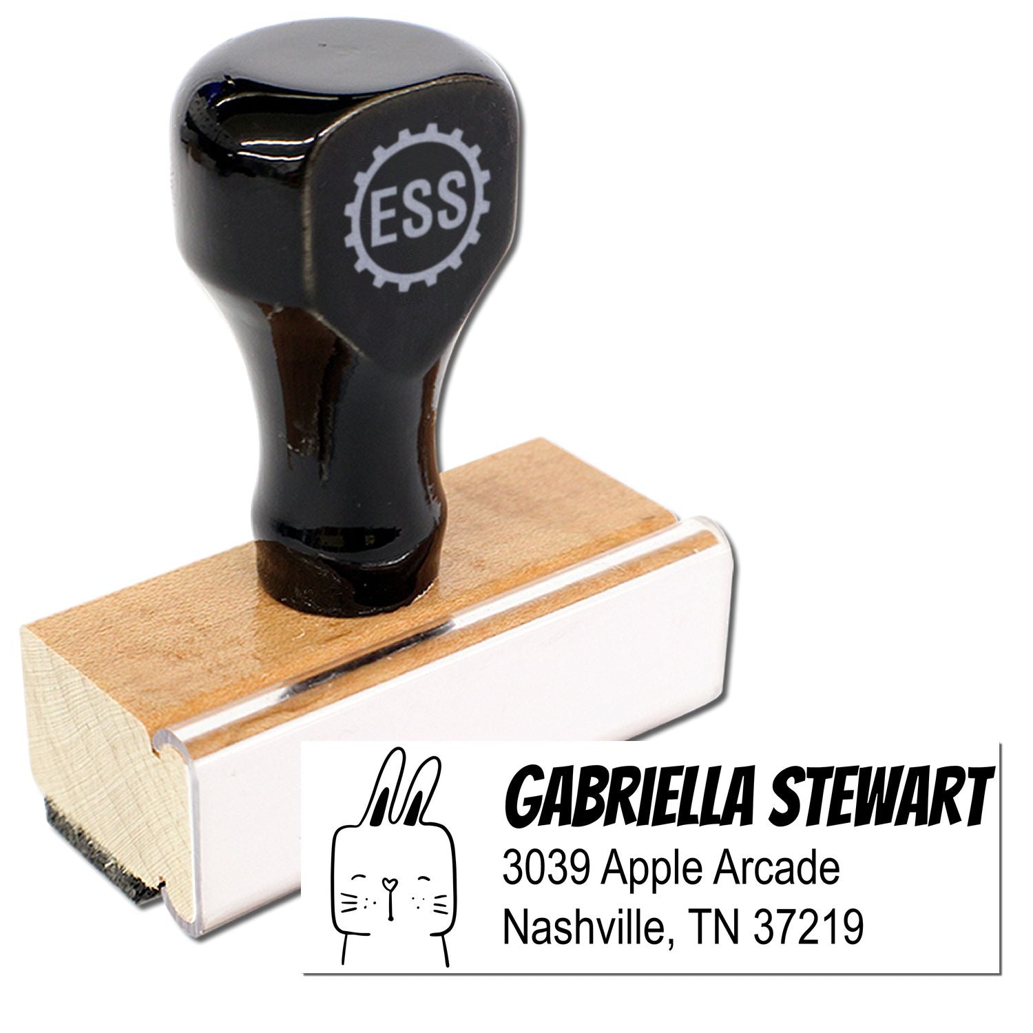 Wood handle fuzzy rabbit handmade home address rubber stamp with "ESS" logo on top. Customized mailing stamper featuring name and address: Gabriella Stewart, 3039 Apple Arcade, Nashville, TN 37219.