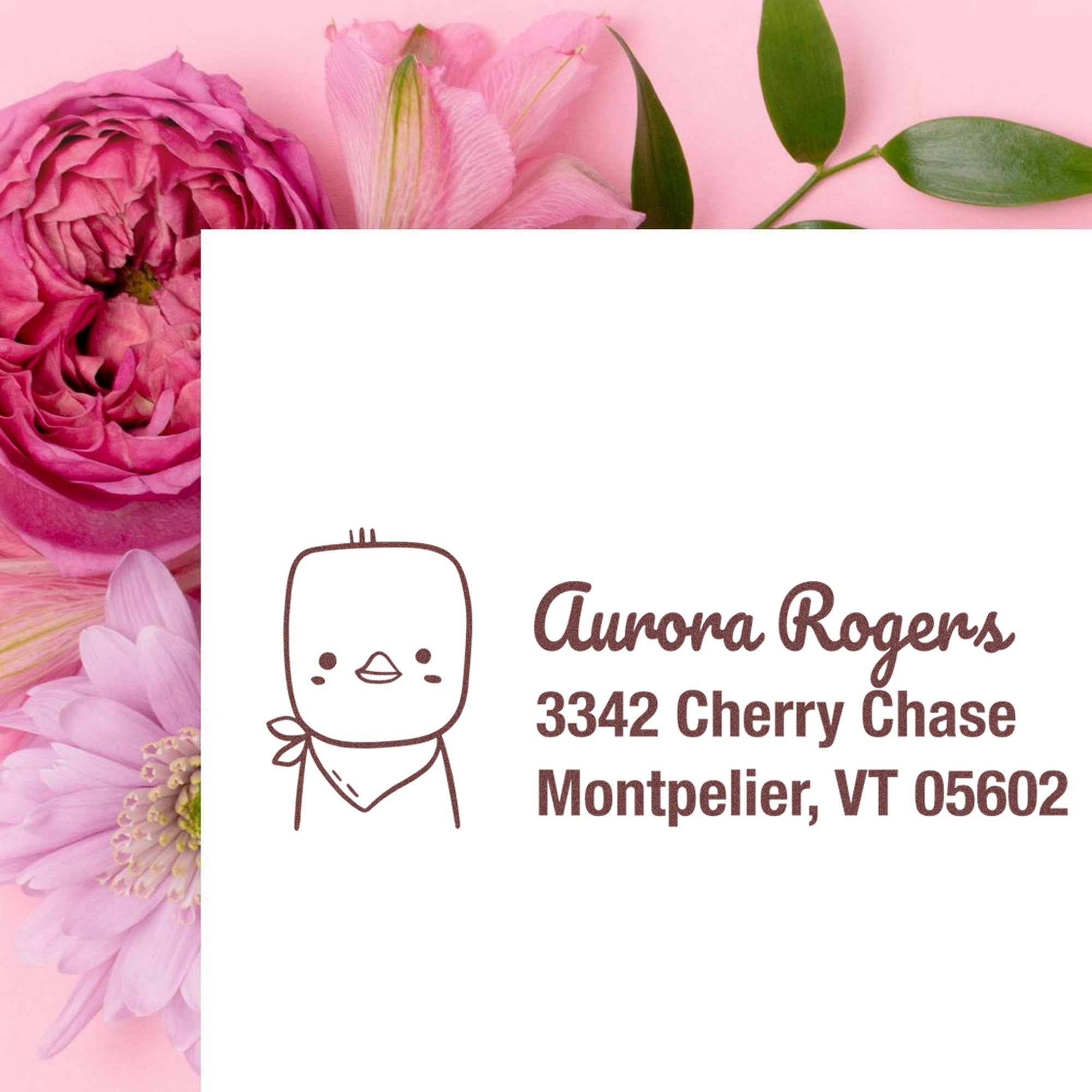 Wood handle cute chick handmade mail address rubber stamp on white paper with customizable home stamp design. The stamp features a cartoon chick and the name "Aurora Rogers" with an address, set against a pink floral background.