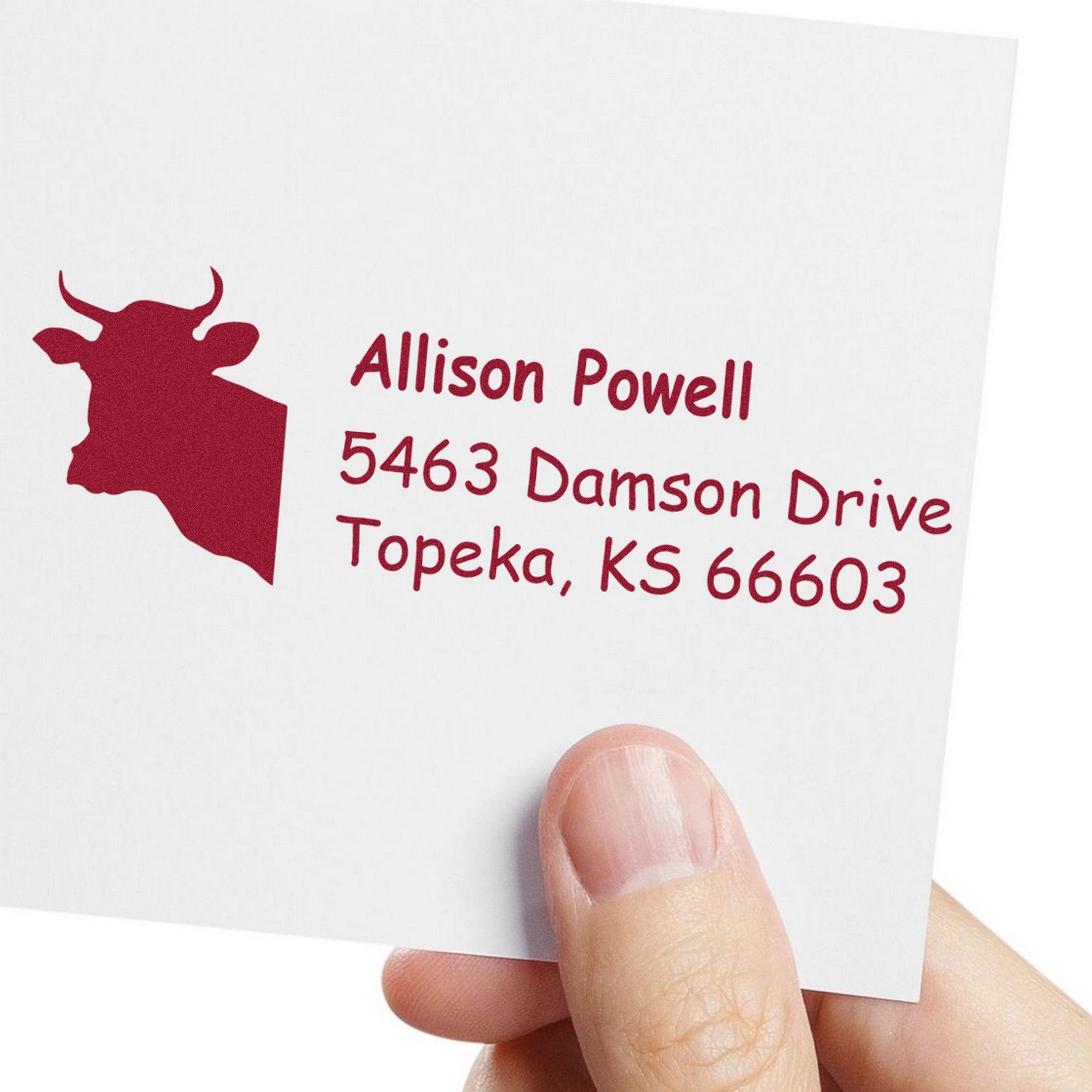 Custom red address stamp and seal with bull silhouette and Allison Powell, Topeka, KS 66603 on white card.