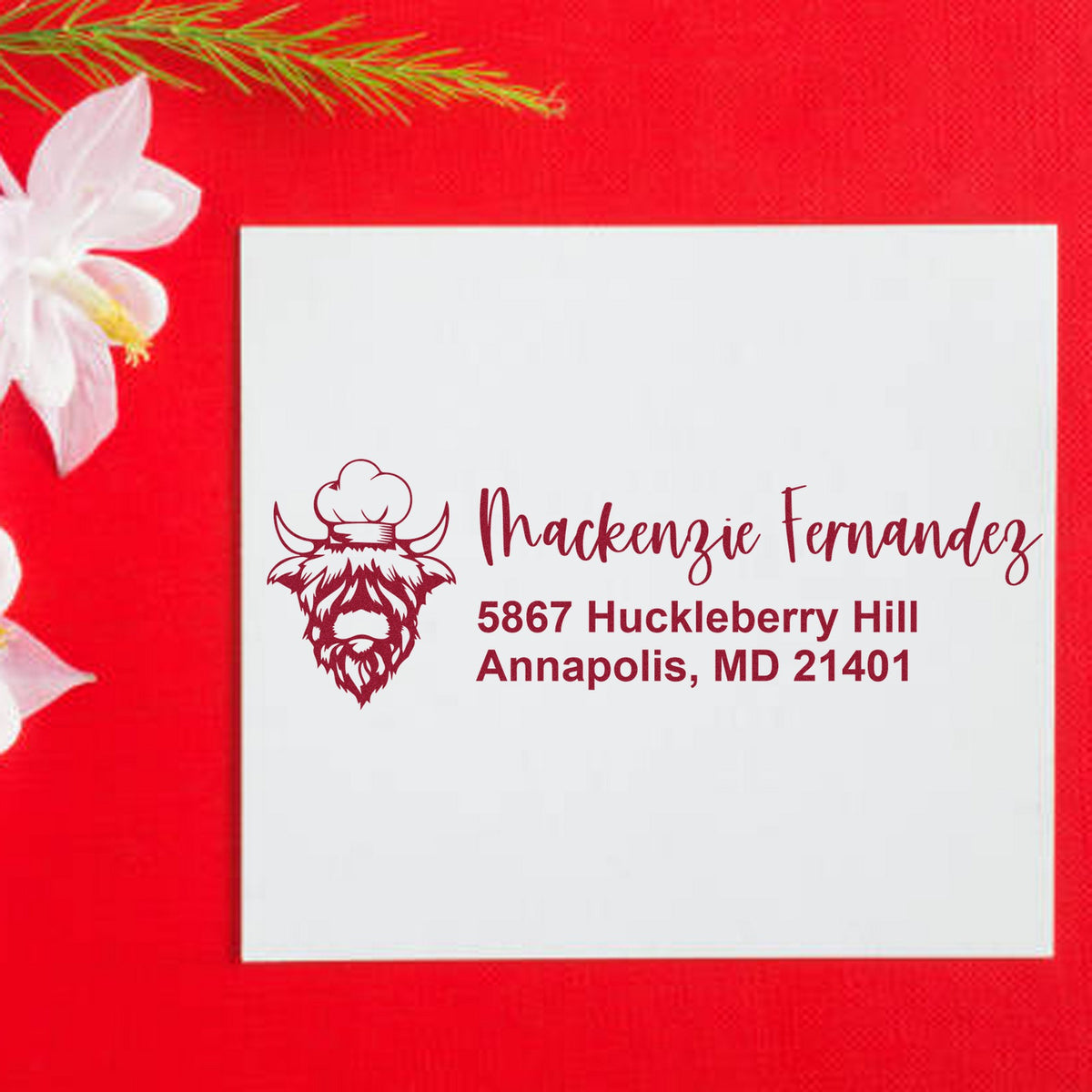 Personalized maroon address stamp and seal with bearded chef logo on a white card against a bright red background.