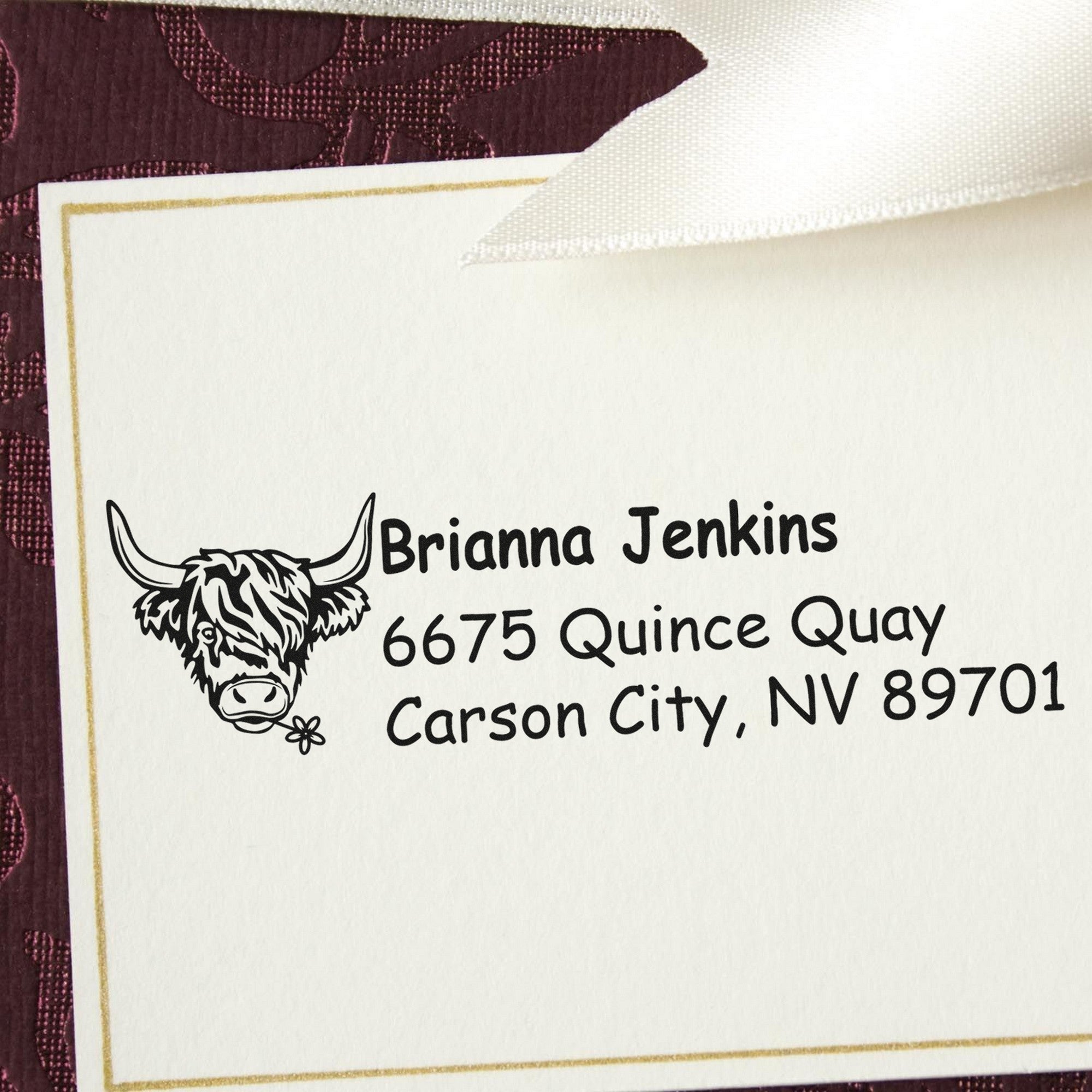 Custom stamp-and-seal sample with white paper, gold border, black bull logo, and Brianna Jenkins address on burgundy.