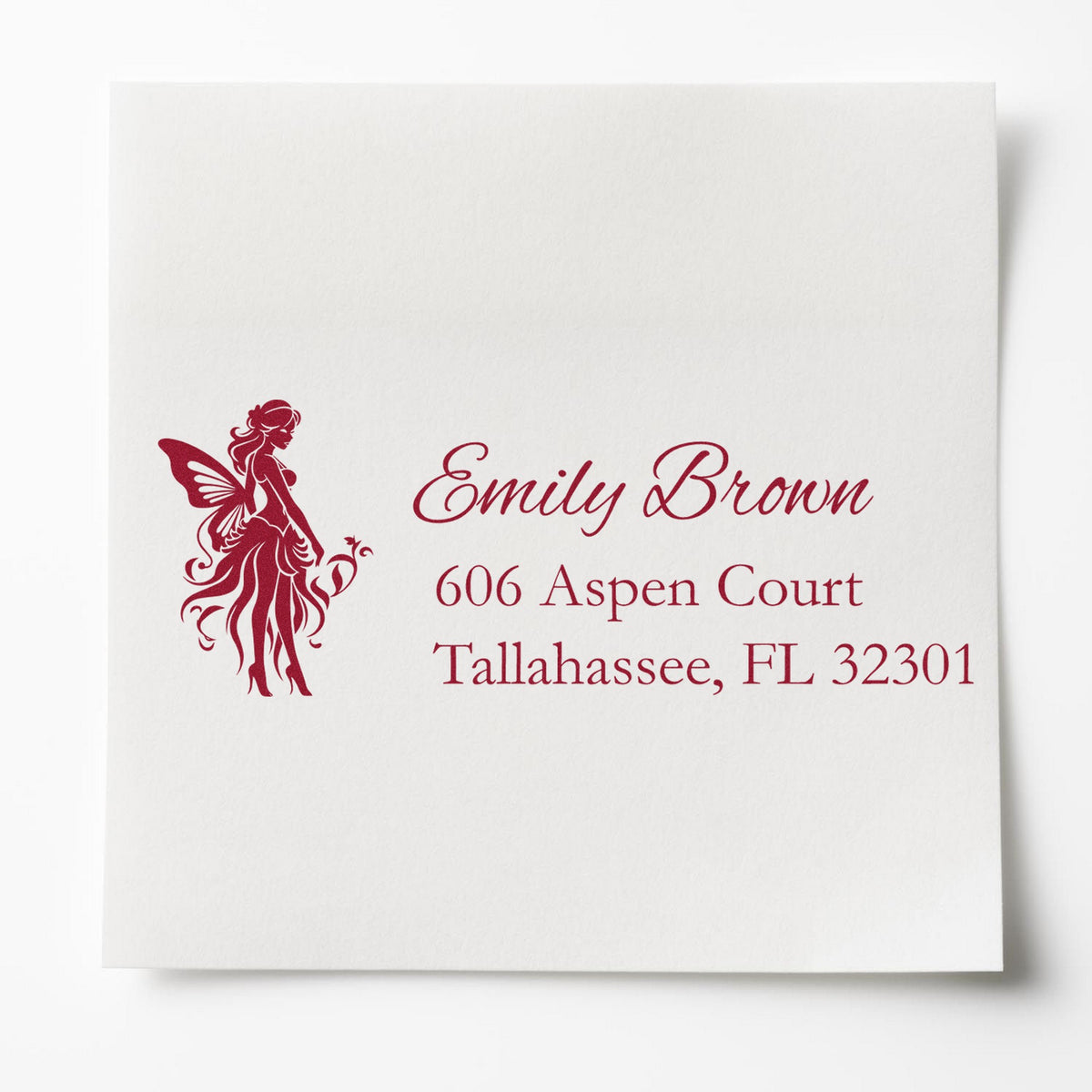 Burgundy custom address stamp with fairy silhouette for Emily Brown, 606 Aspen Court, Tallahassee, FL 32301.