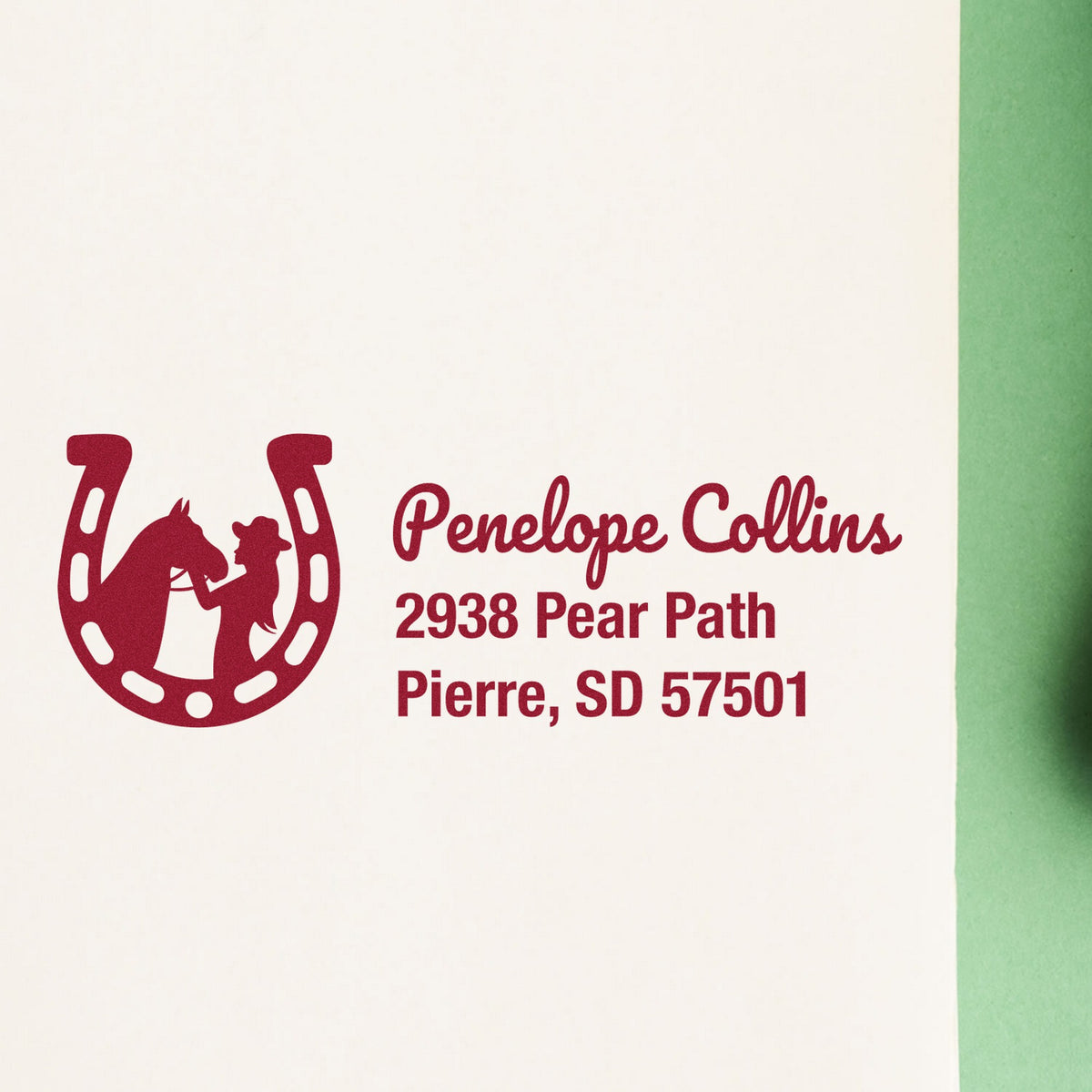 Maroon custom stamp and seal with horse-and-rider horseshoe logo, Penelope Collins address on cream paper, green edge