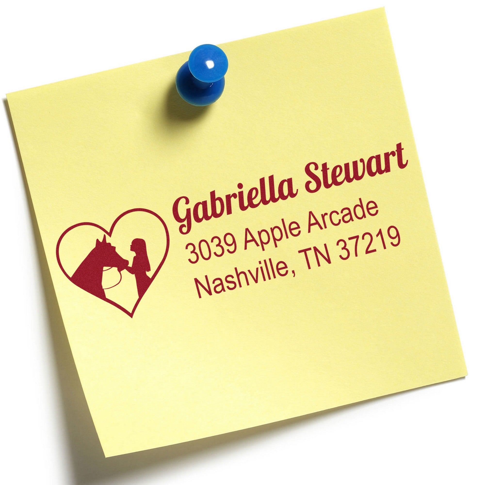 Yellow note pinned with a blue pushpin and red custom return address stamp, featuring a heart horse-and-woman seal design.