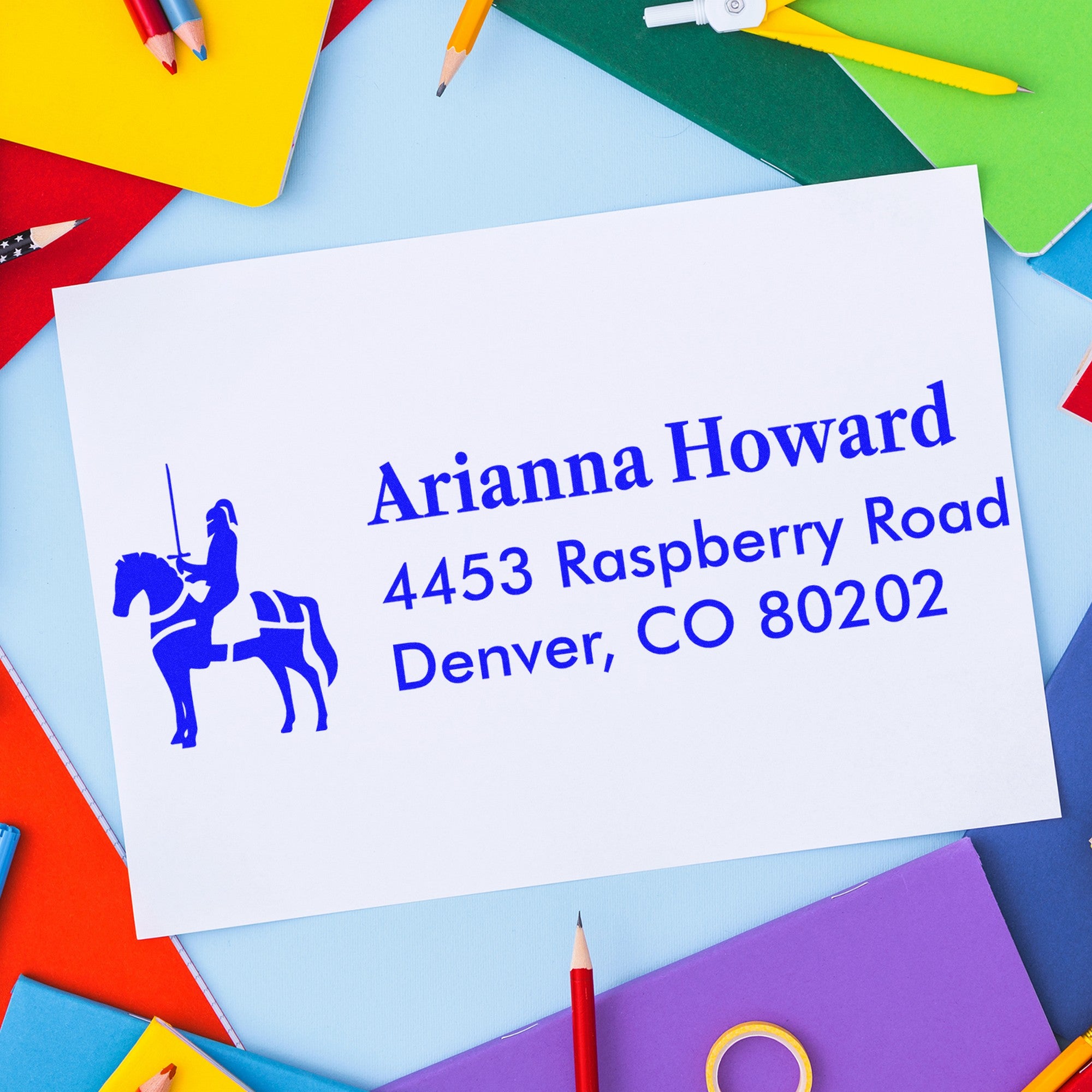 Colorful stationery with a white envelope featuring a blue horse seal and custom address stamp.