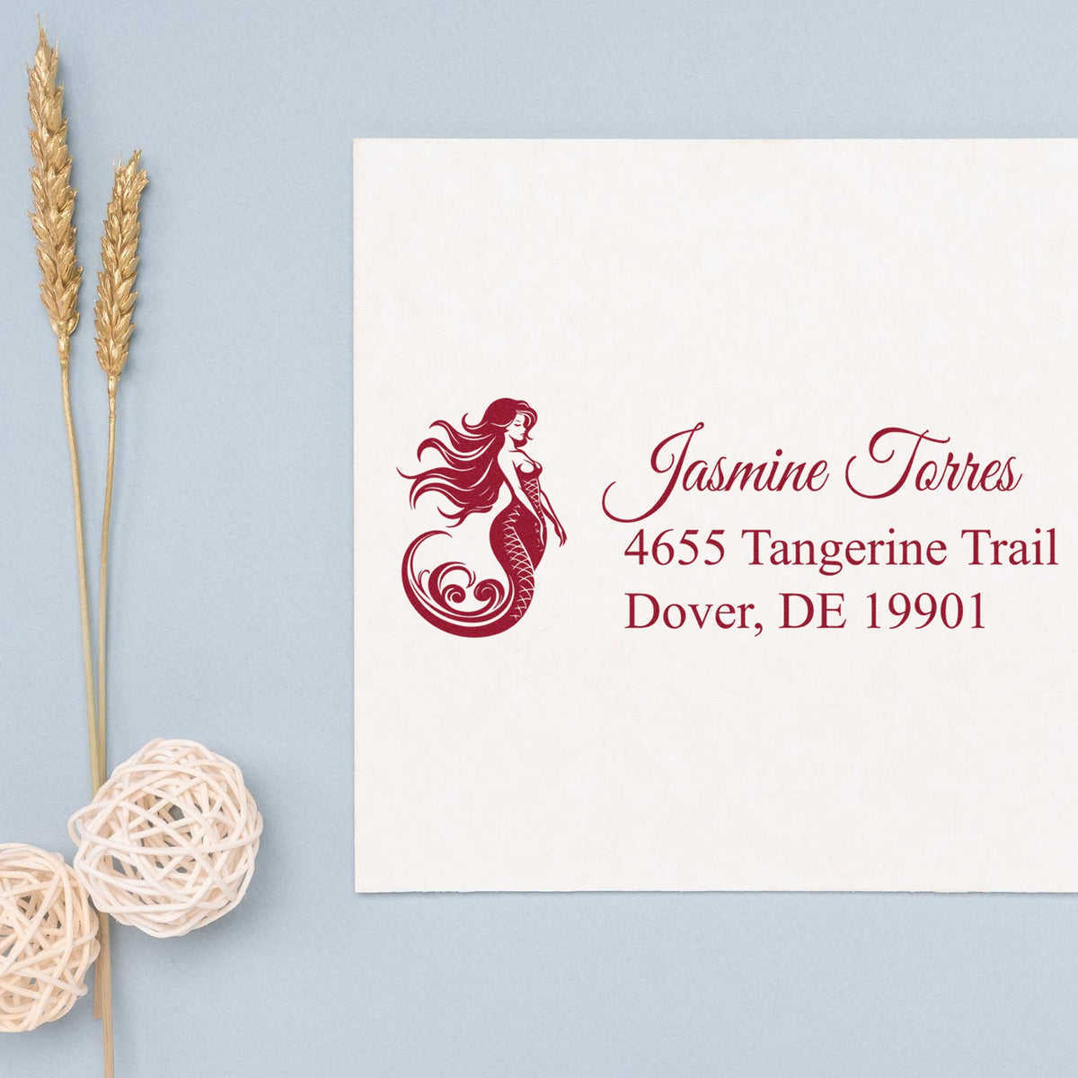 Maroon mermaid custom return address stamp on white card with Jasmine Torres, Dover, DE 19901