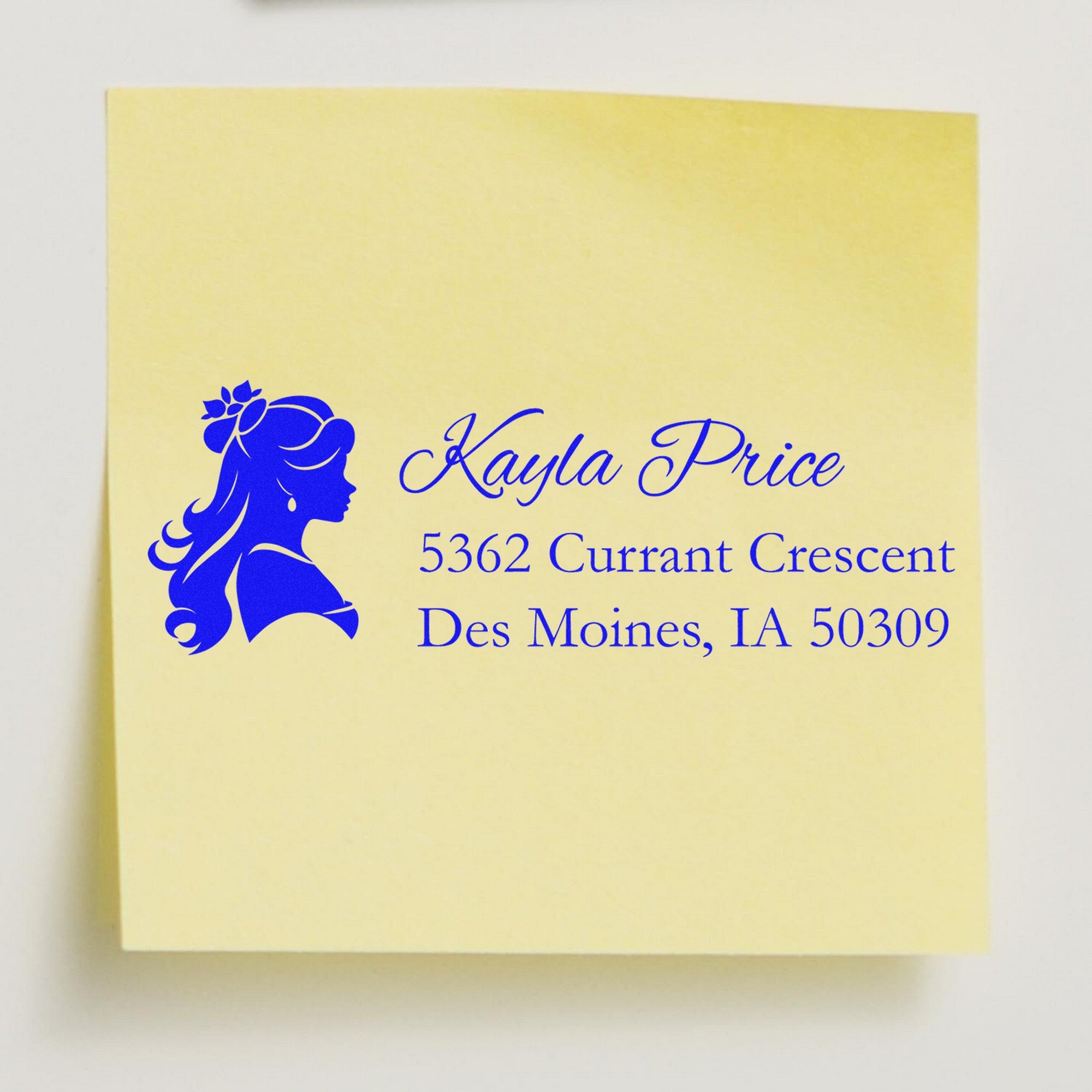 Custom blue stamp and seal design with female silhouette and return address on pale yellow paper