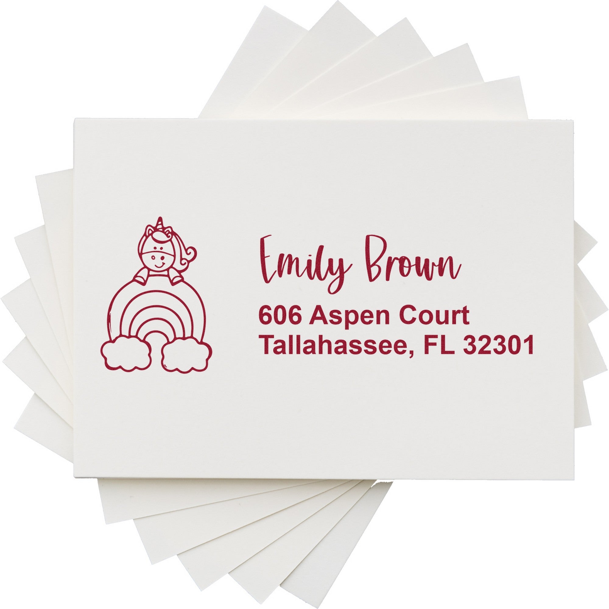 White envelopes with burgundy personalized stamp and seal featuring a unicorn rainbow design, Emily Brown name, and Tallahassee address.