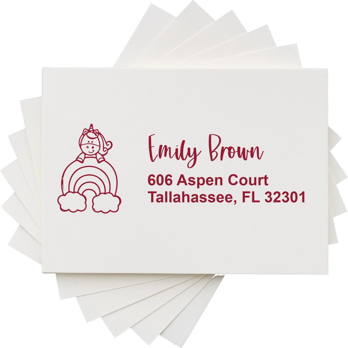 White stamp and seal sheets with red unicorn rainbow design and personalized Emily Brown address, Tallahassee FL 32301.
