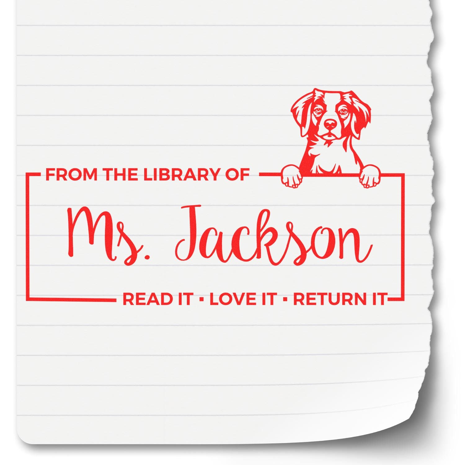 Red custom library stamp seal with dog illustration, Ms. Jackson name, and return-it text on white lined paper.