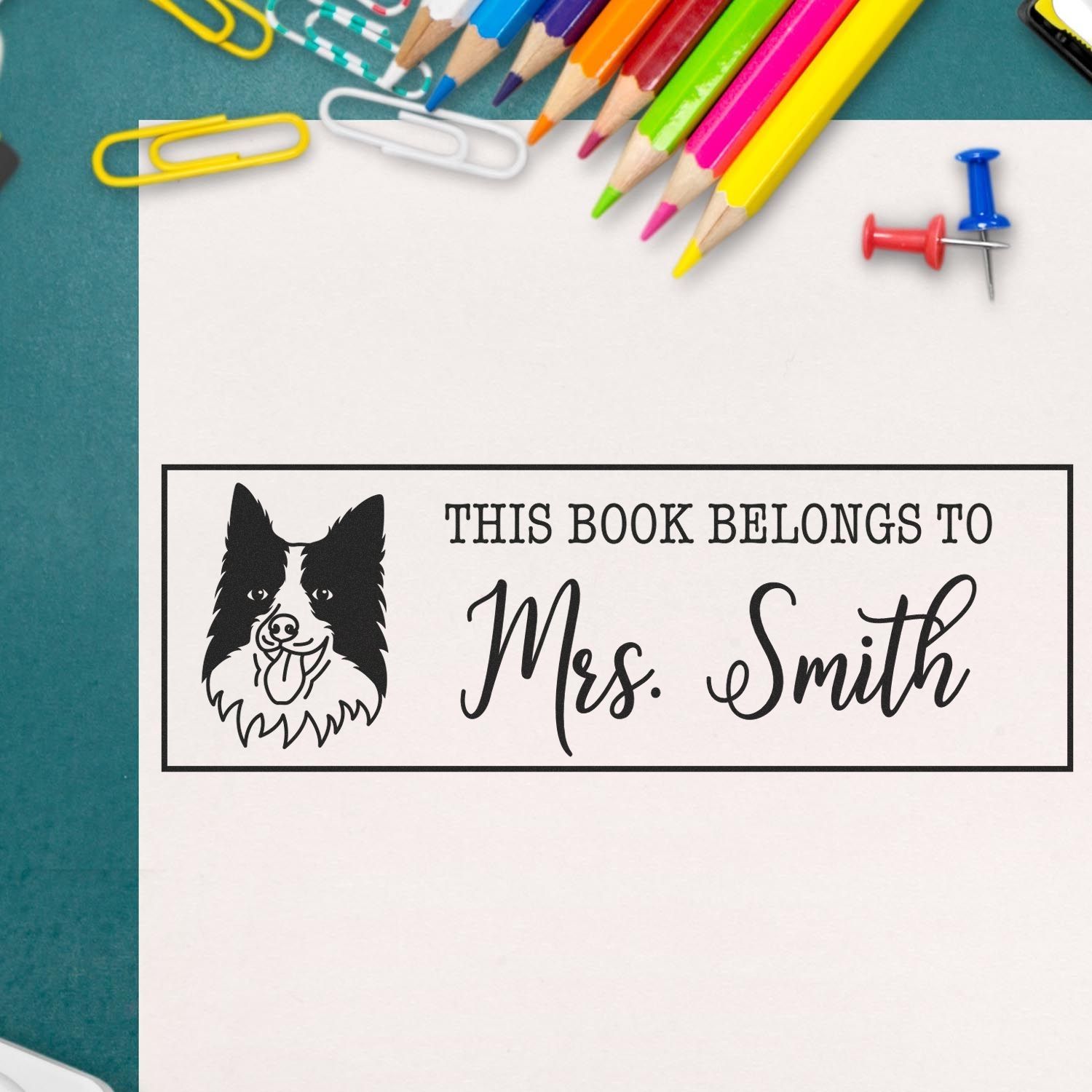Border Collie dog stamp with wood handle from ESS, in use, perfect for custom bookplates and craft projects.