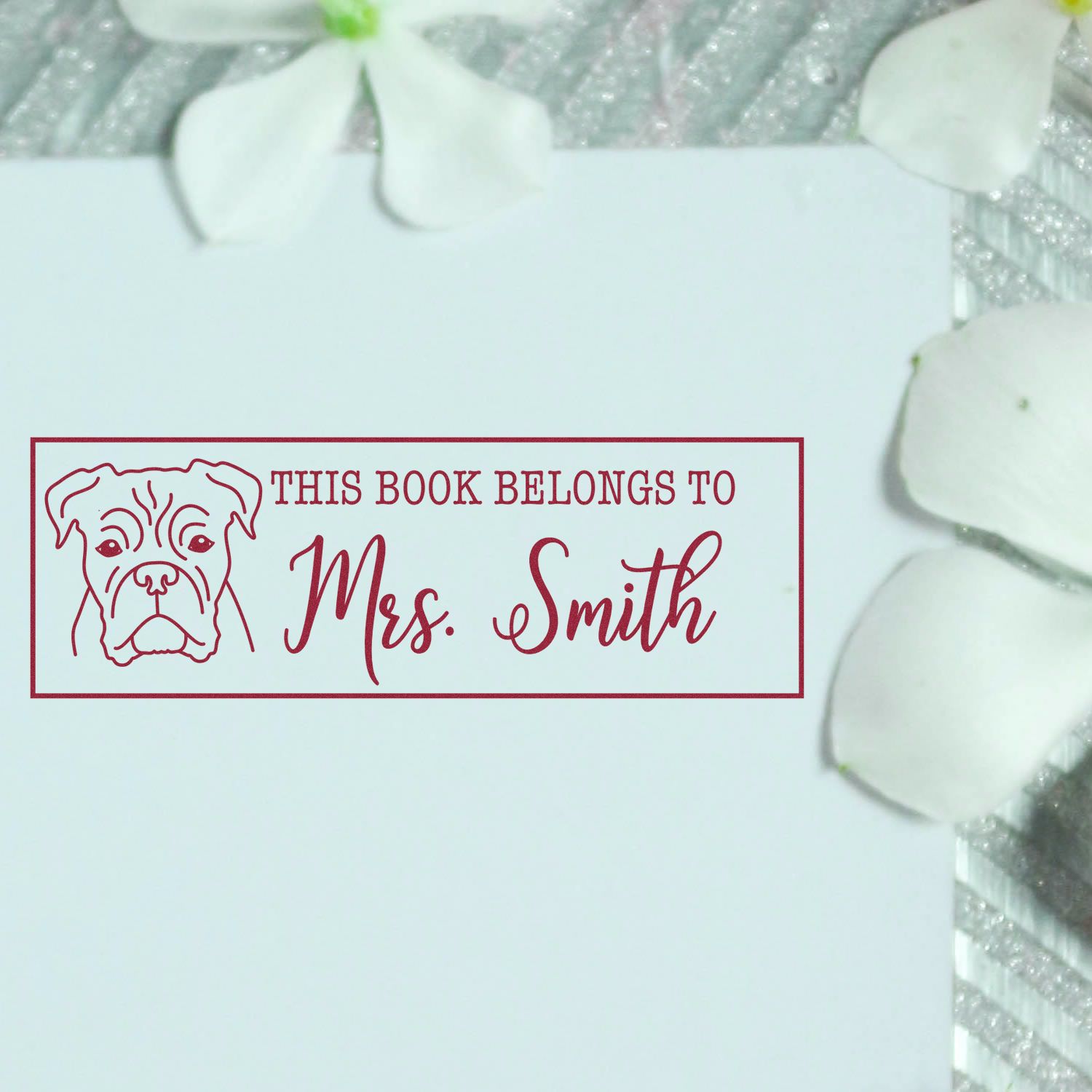 ESS Wood Handle Boxer Dog Rubber Stamp in use, featuring custom book identification design on a wooden handle.