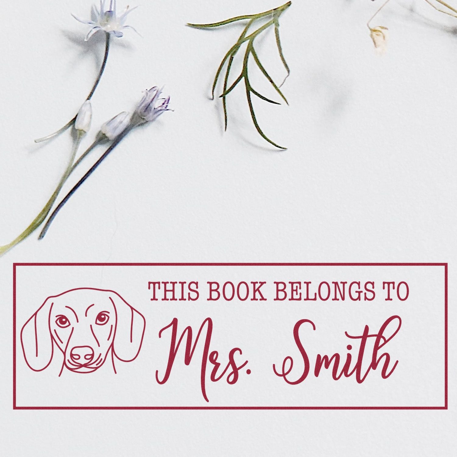 ESS Wood Handle Dachshund Dog Stamp in use, personalized “Belongs To” rubber stamp with dachshund illustration.