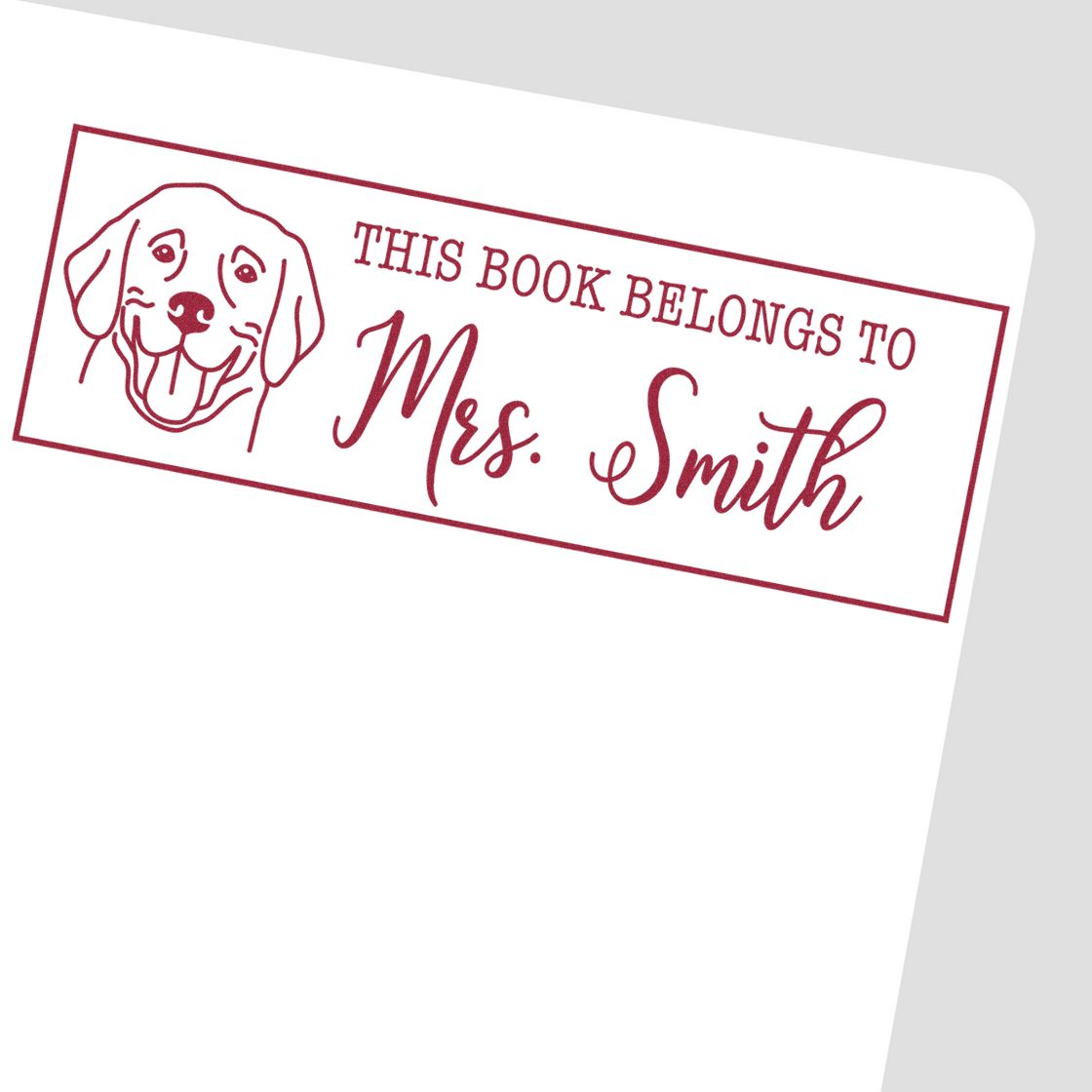 Maroon book stamp seal with dog outline and This book belongs to Mrs. Smith text on white background