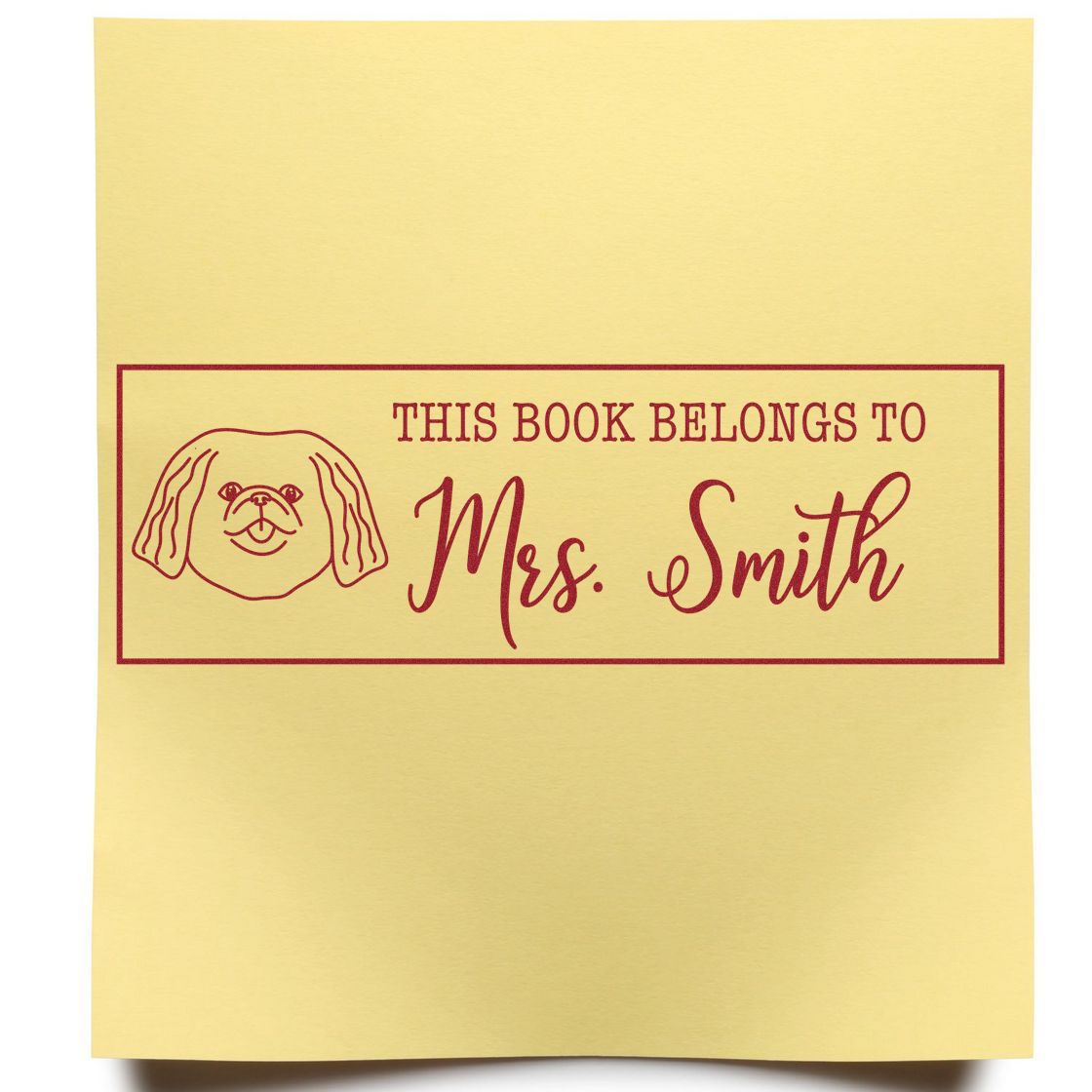 Custom-made Pekingese dog rubber stamp with wood handle from ESS, in use on paper, featuring detailed Pekingese illustration.