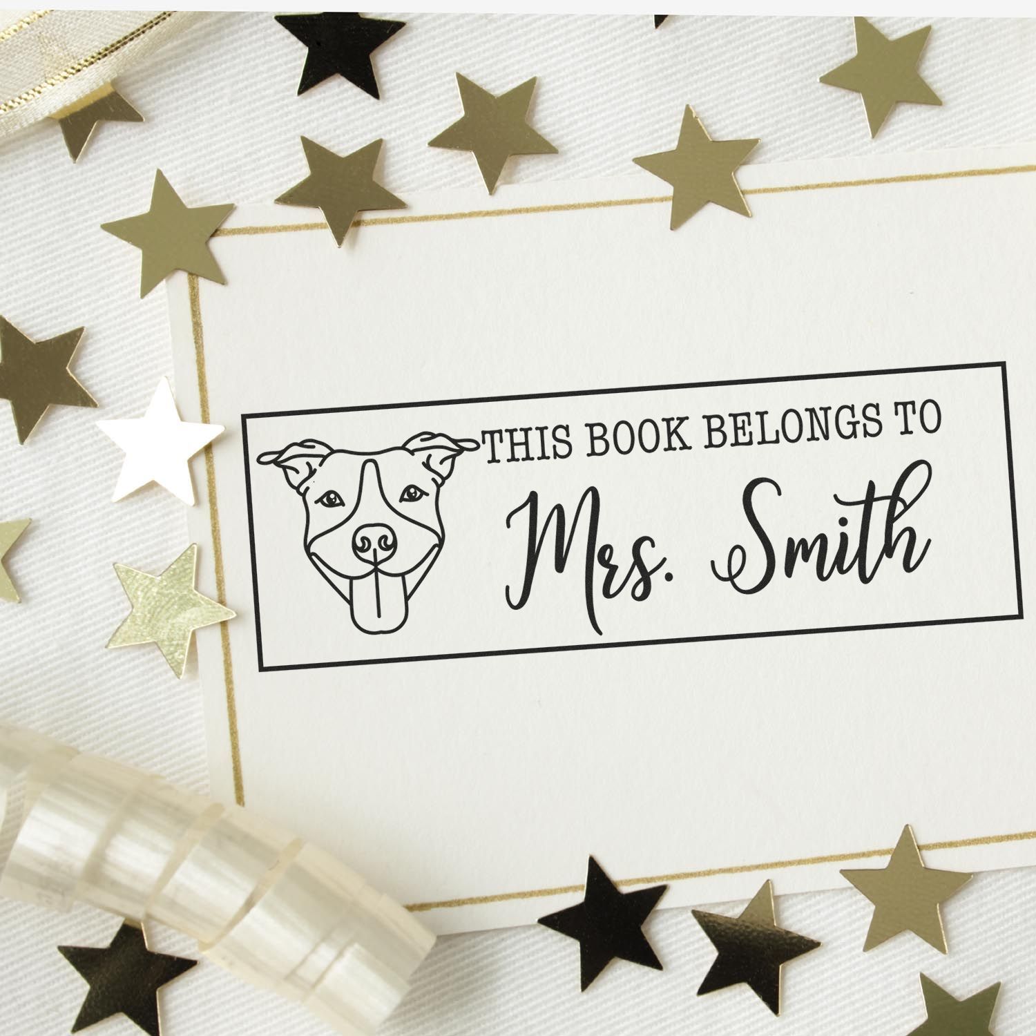 Custom book stamp and seal with dog outline, Mrs. Smith text, black on white, surrounded by gold and black stars.