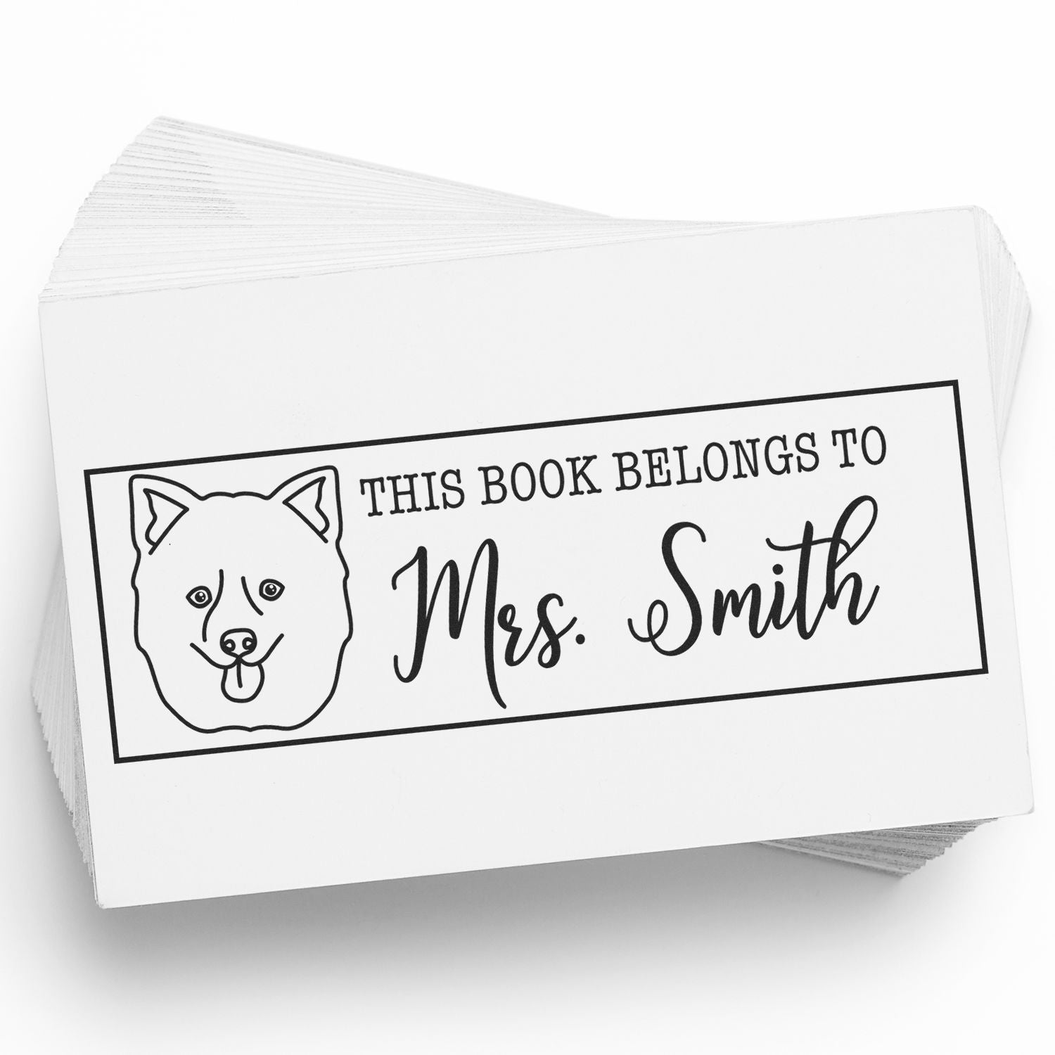 Black-and-white custom book stamp with dog outline and This Book Belongs to Mrs. Smith on stacked white cards.