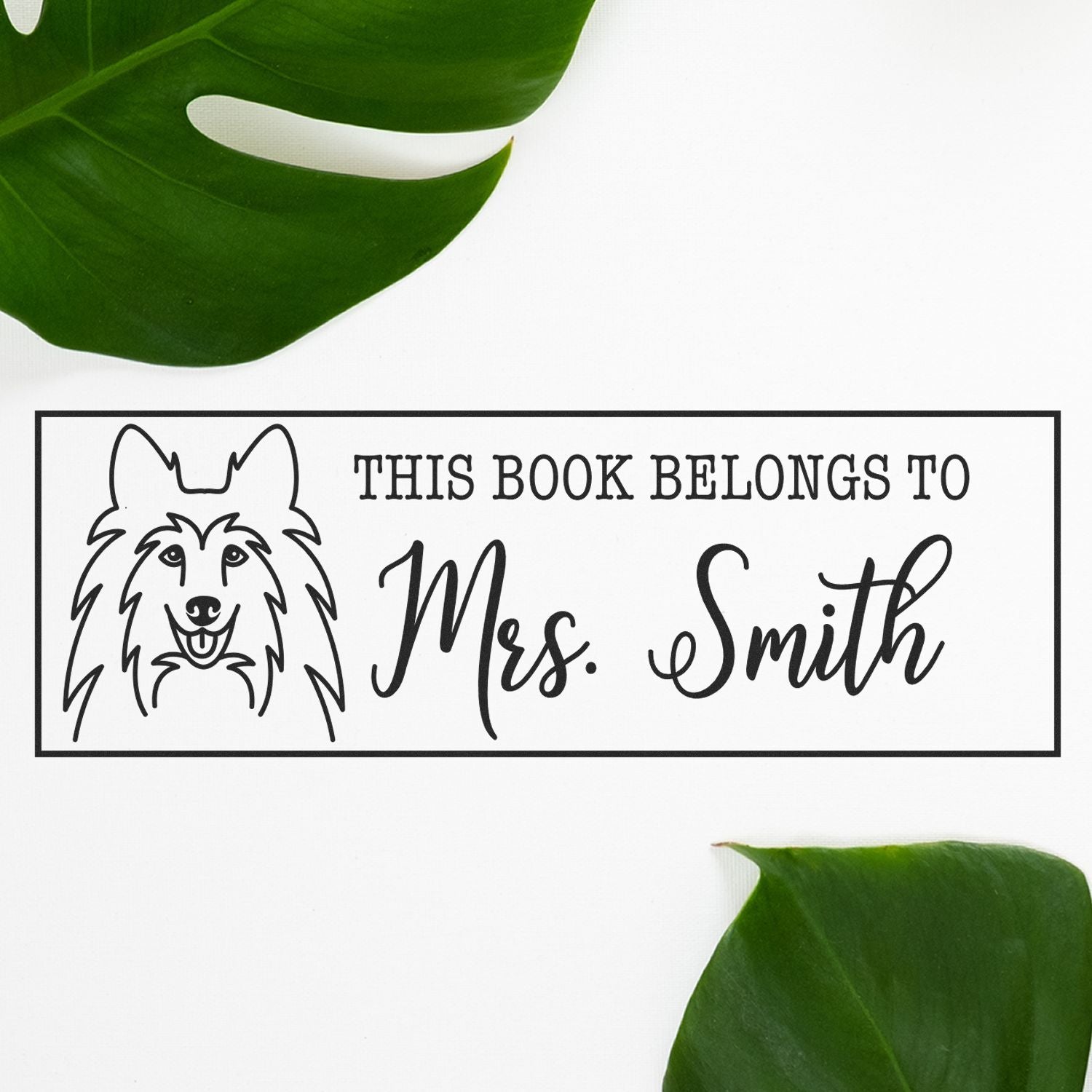 Custom black bookplate stamp and seal with dog illustration, Mrs. Smith text, on white background with green leaves.