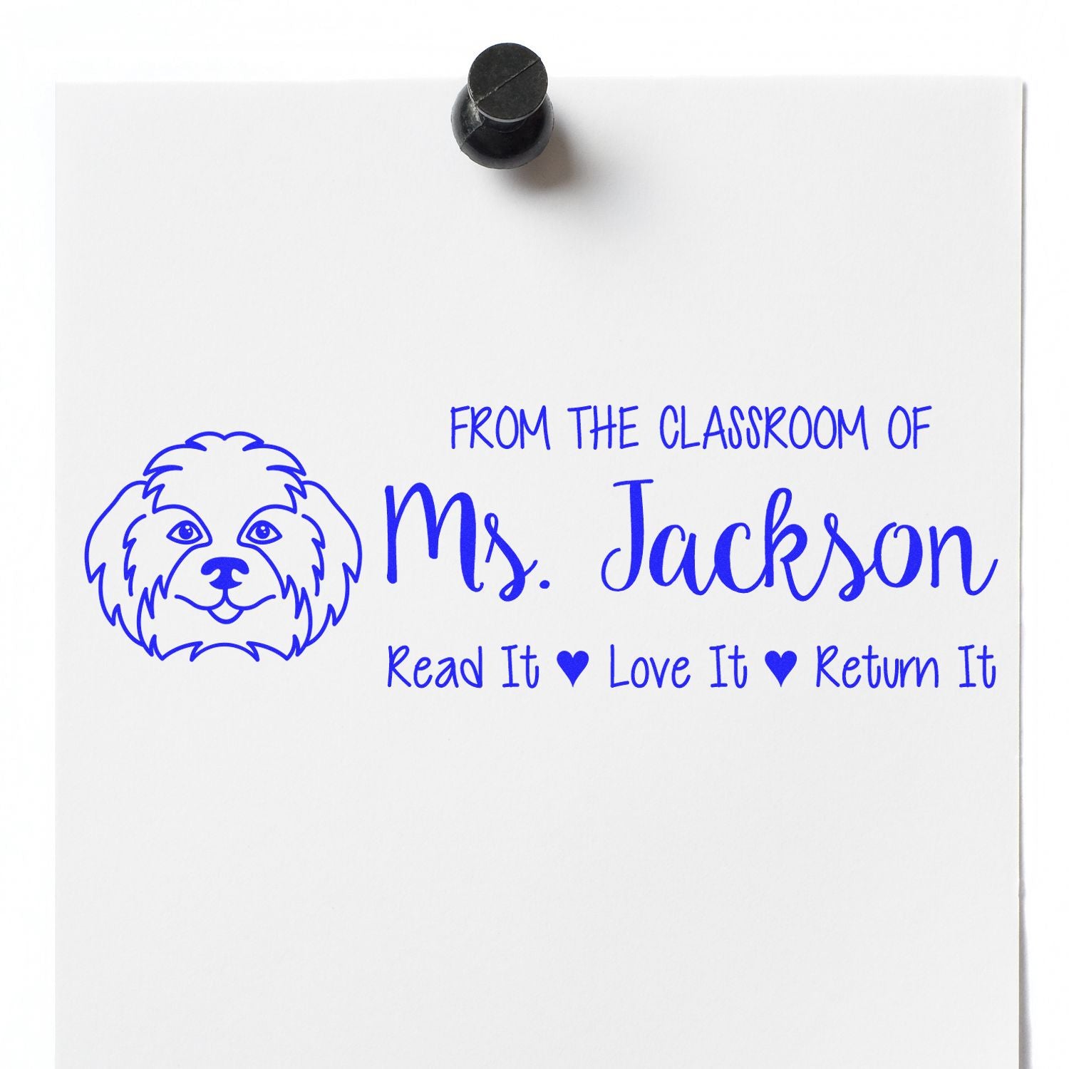 Blue custom classroom stamp seal with dog outline, Ms. Jackson, and Read It ? Love It ? Return It on white paper.
