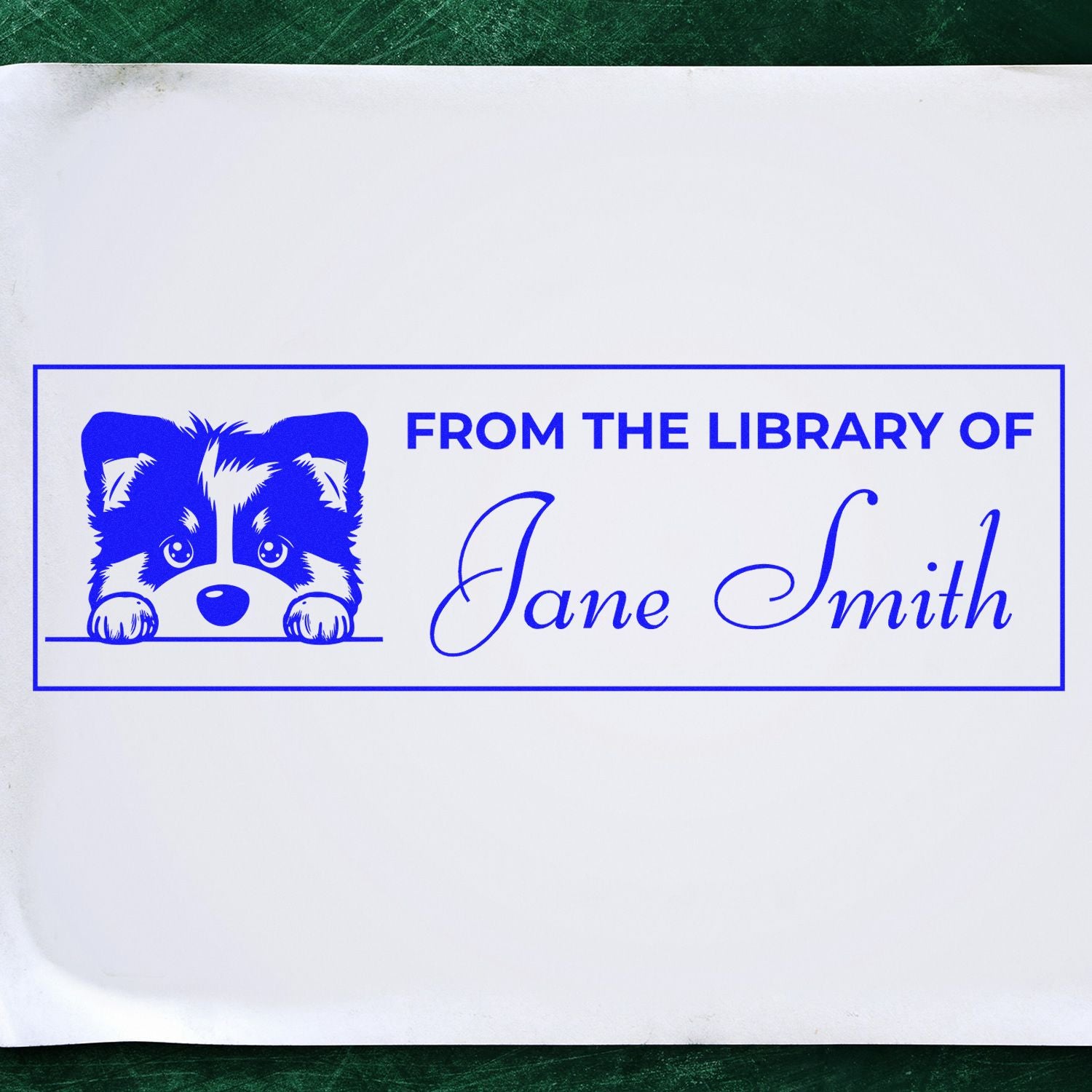 Blue custom library stamp seal with puppy icon and From the Library of Jane Smith on white paper.