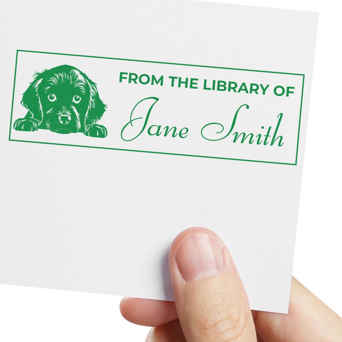 Green personalized library stamp seal with dog illustration and Jane Smith name on white paper