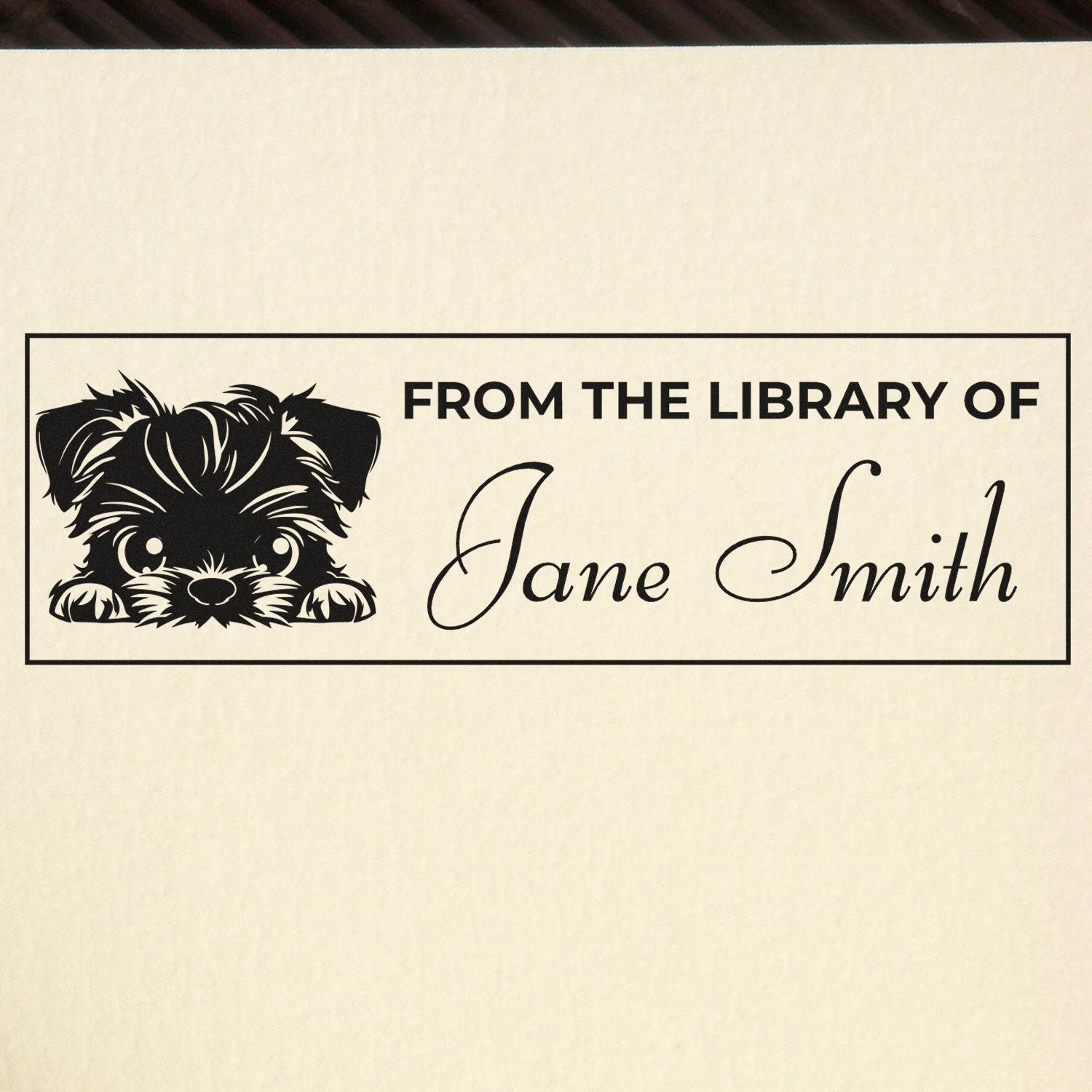 Custom black library book stamp and seal with dog graphic, cream background, and From the Library of Jane Smith text.