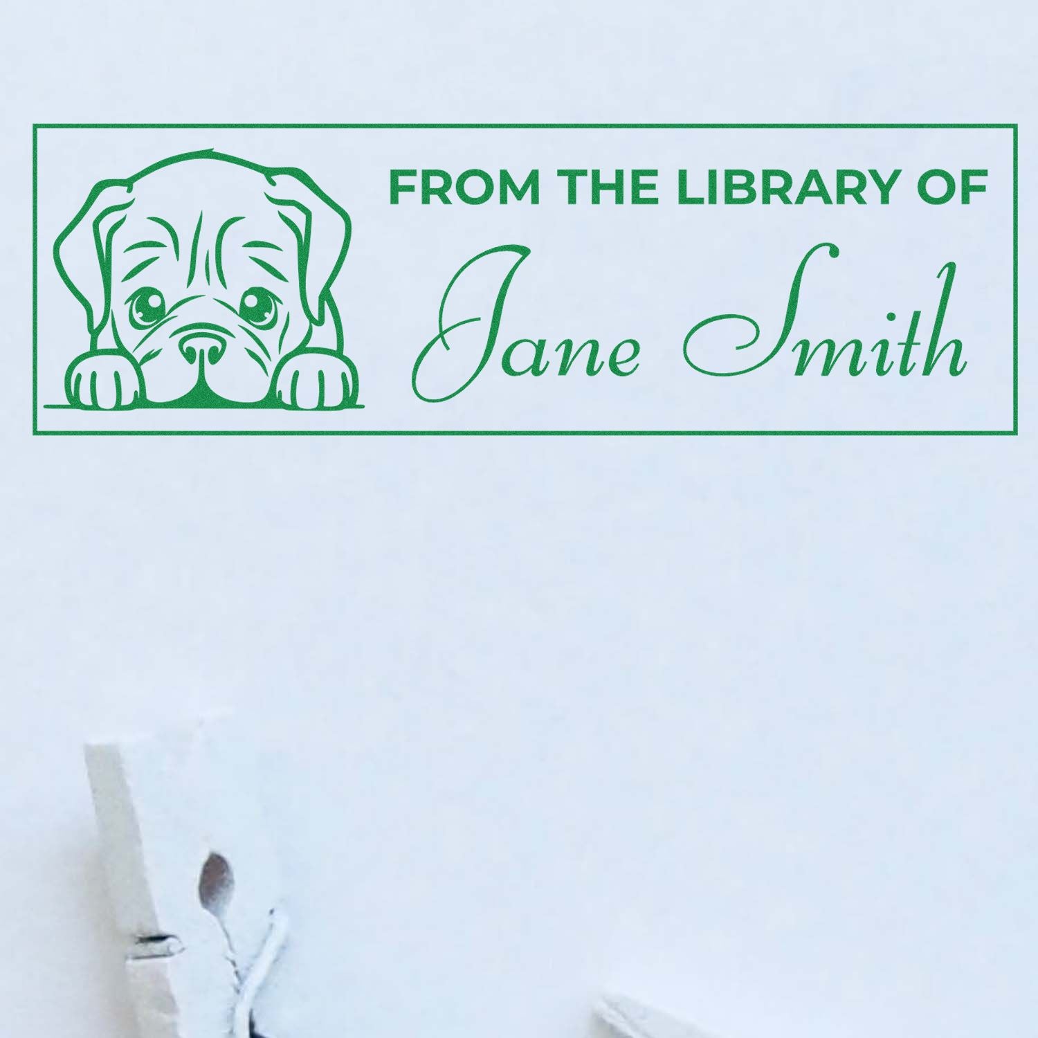 Green custom library book stamp and seal with puppy illustration and From the Library of Jane Smith on white paper.