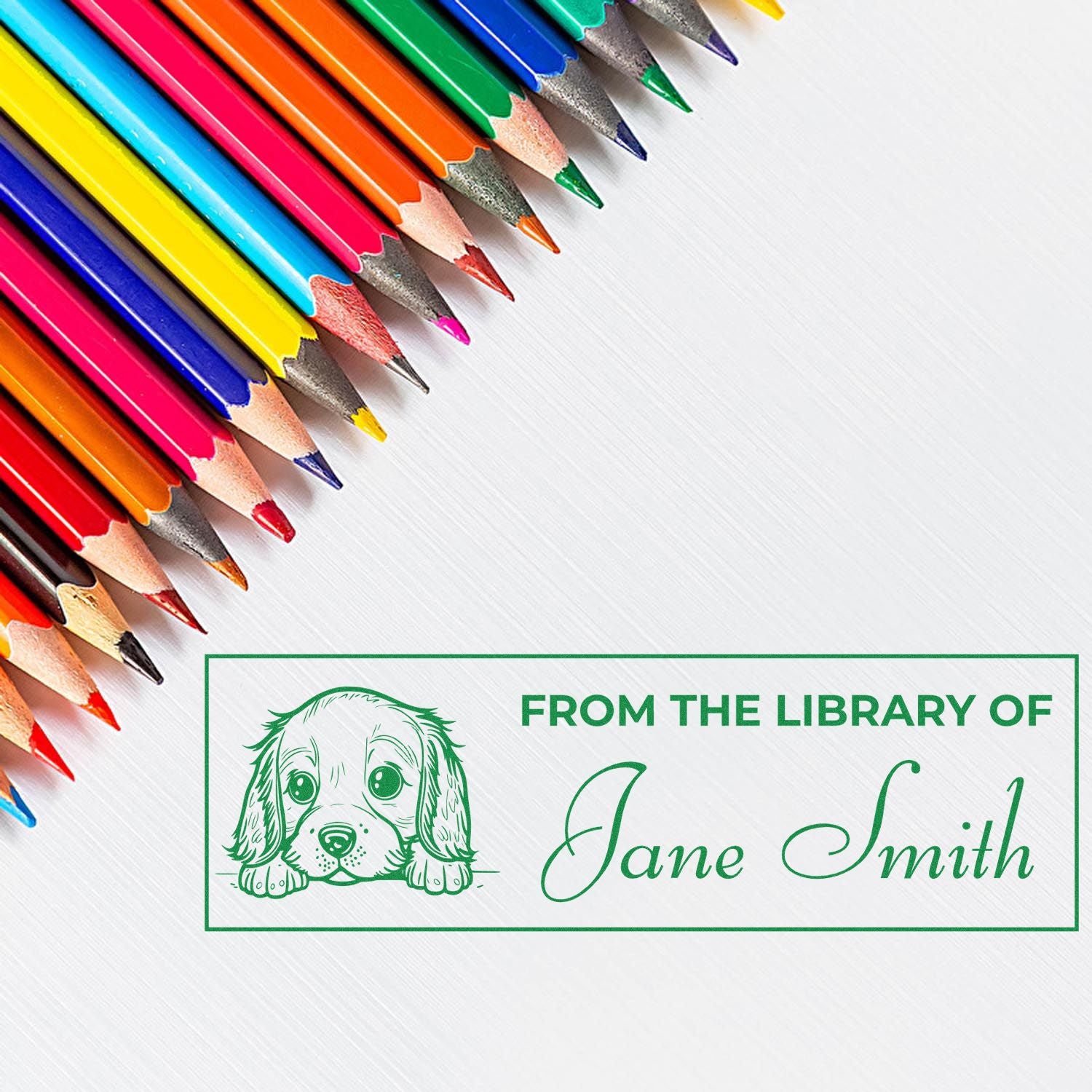 Colorful pencils framing a green custom library stamp and seal with puppy, From the Library of Jane Smith