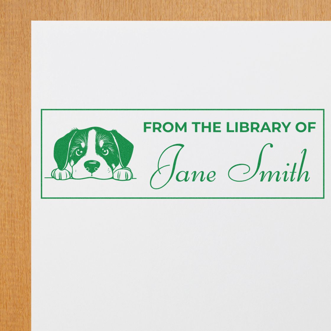 Green custom library stamp and seal with dog illustration, From the Library of Jane Smith, in green on white paper.
