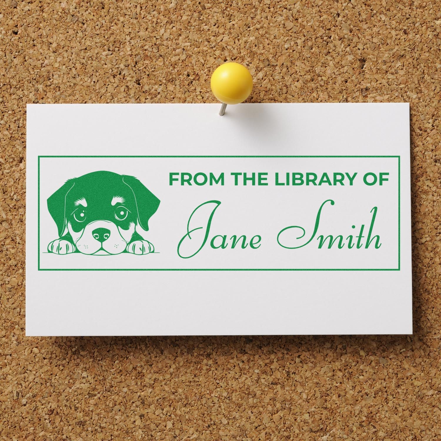Green custom library stamp seal with puppy graphic and Jane Smith on a white card pinned to corkboard.