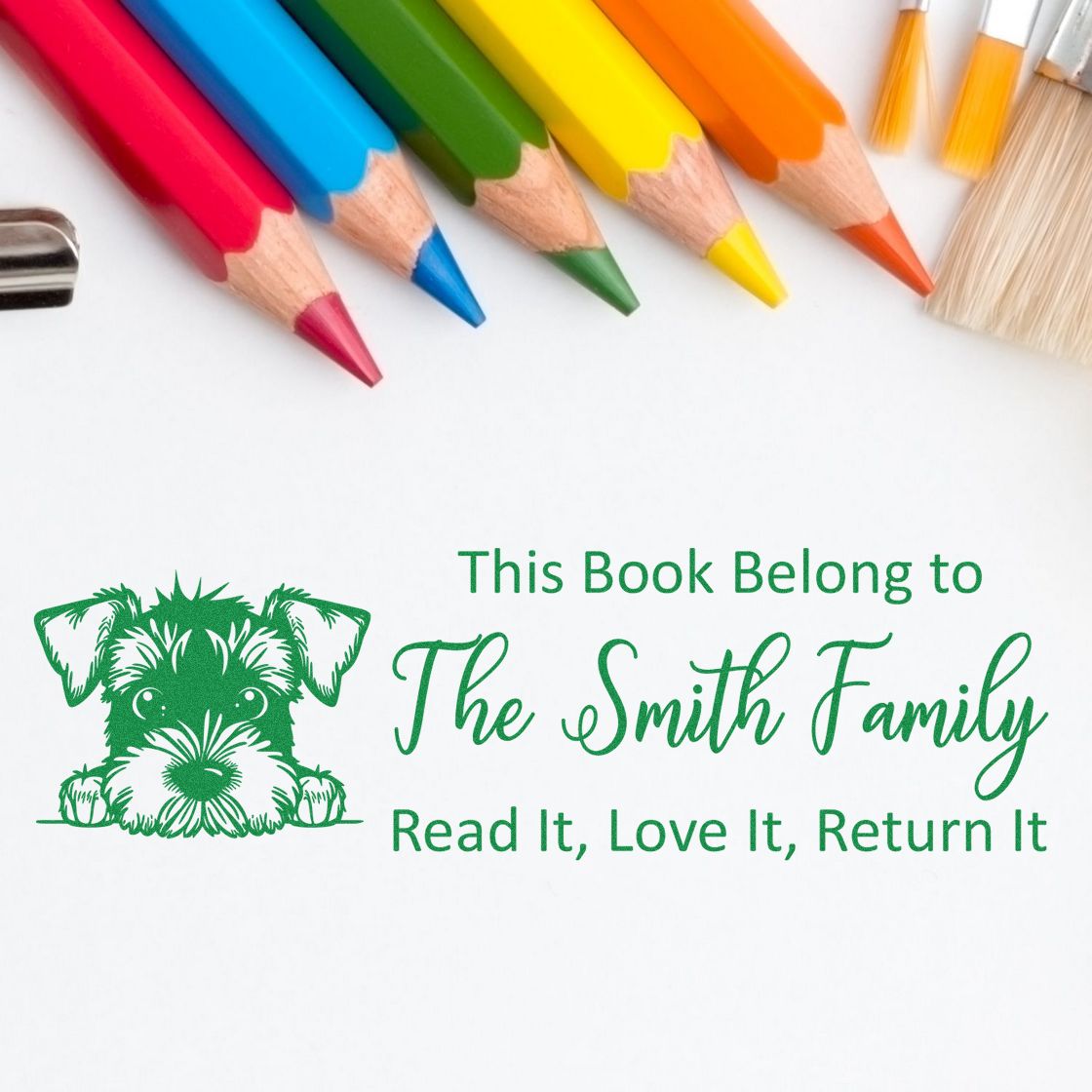 Green custom bookplate stamp and seal with puppy for The Smith Family, under colorful pencils.