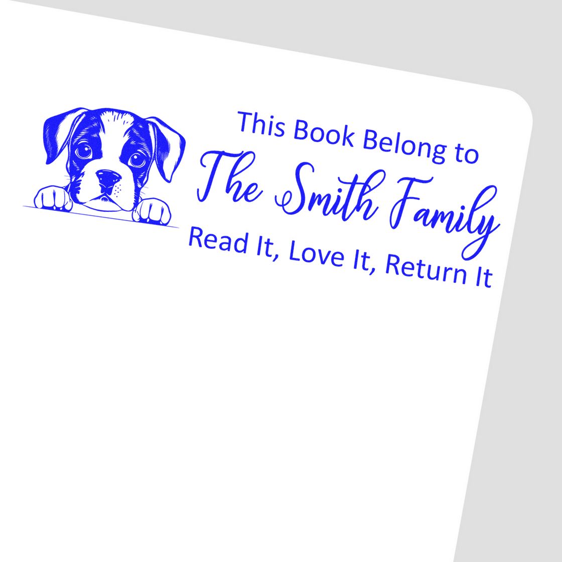 Blue custom book ownership stamp and seal with puppy, The Smith Family text, on white background.