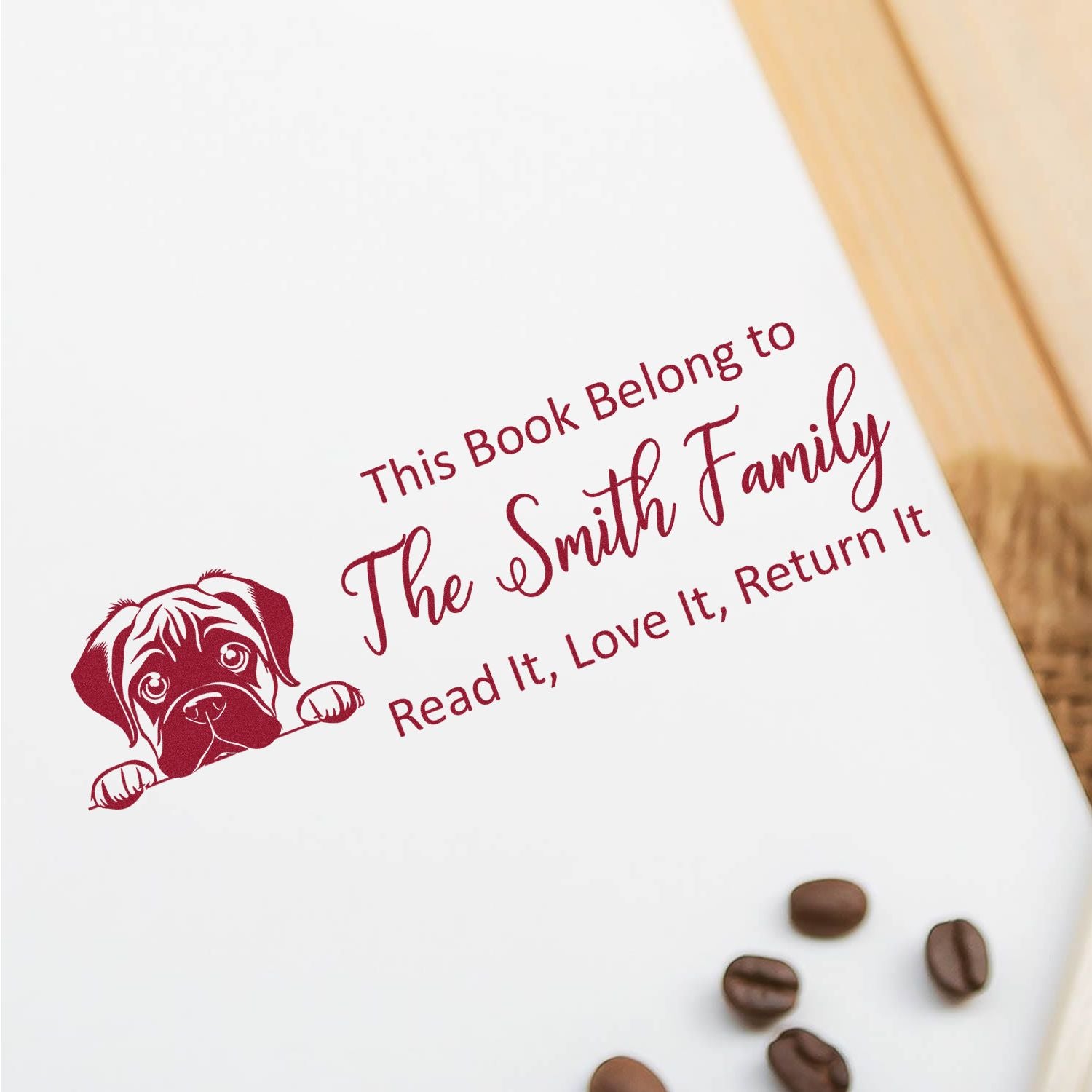 Red dog-themed book ownership stamp reading This Book Belong to The Smith Family on white paper