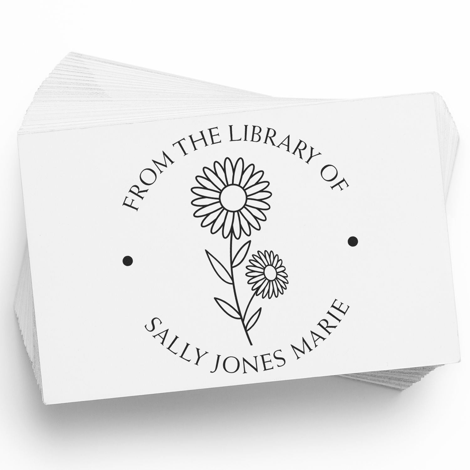 Custom black library stamp seal with daisy floral design and From the Library of Sally Jones Marie on white cards.