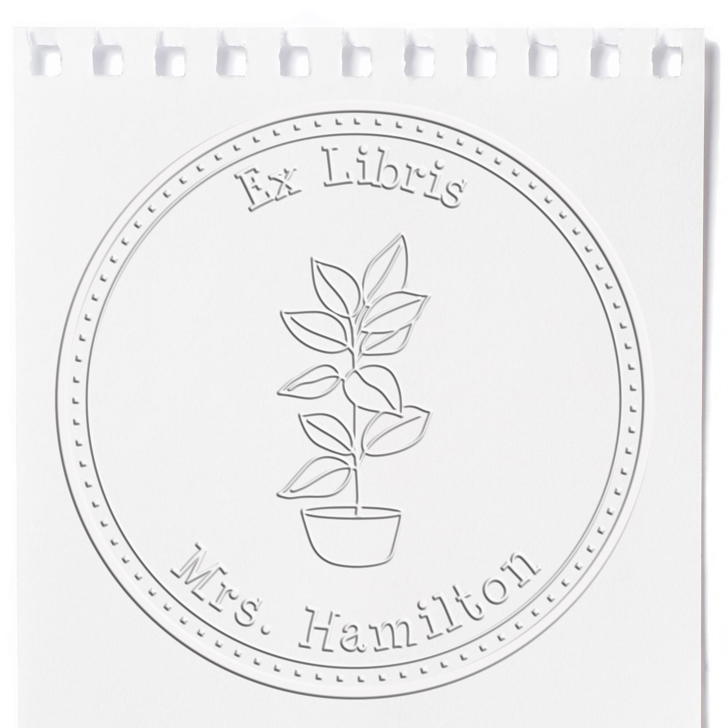 Embossed white circular bookplate stamp seal with potted plant and Ex Libris Mrs. Hamilton text.