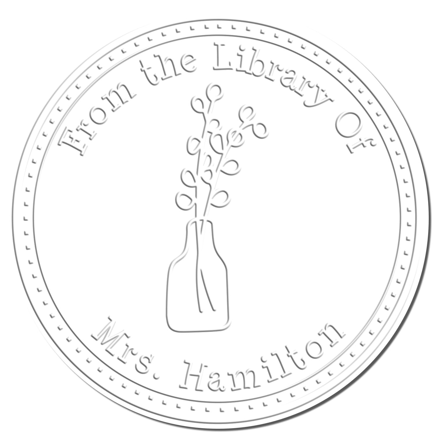 Circular white embossed library stamp seal with vase and flowers, reading From the Library of Mrs. Hamilton.