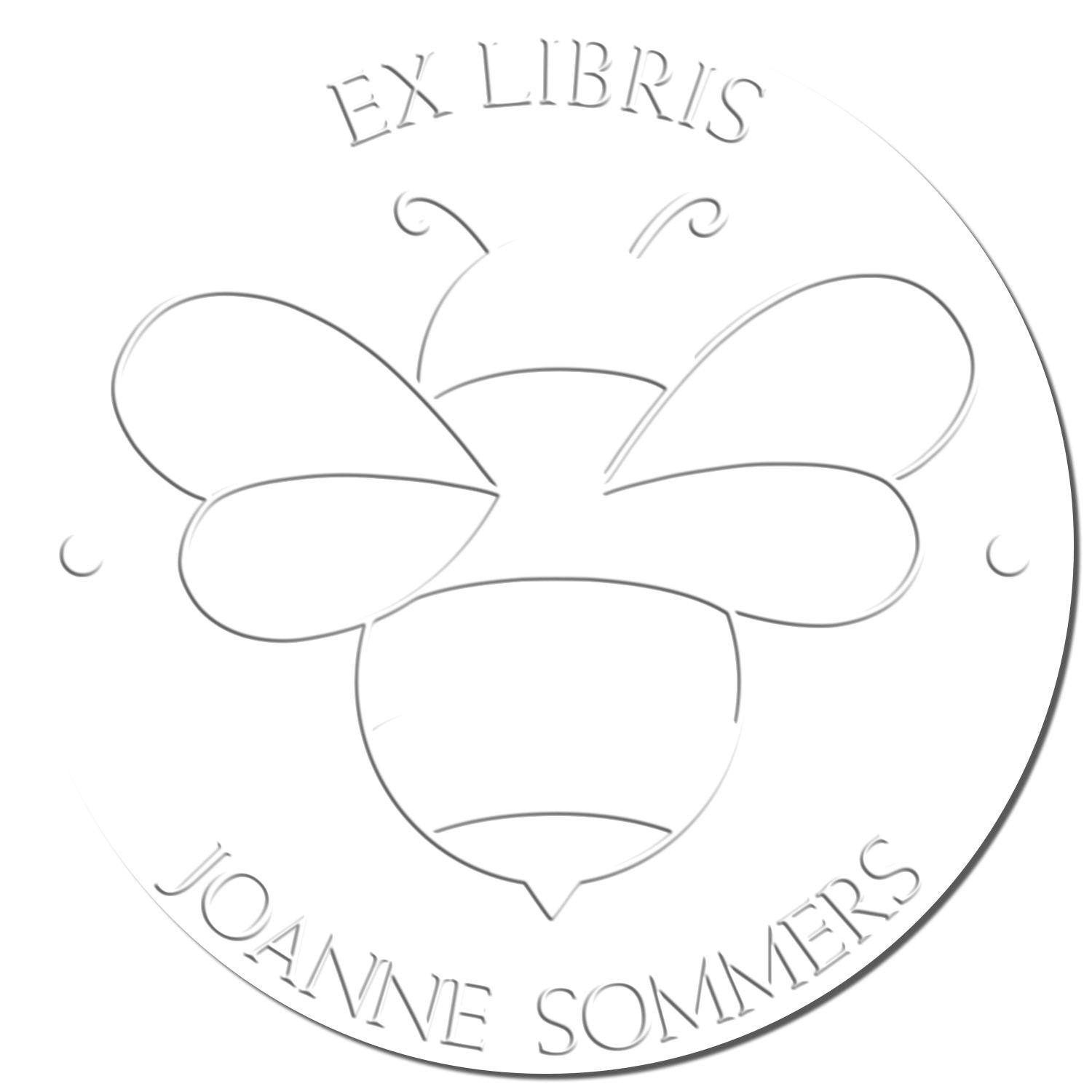 White circular embossing seal stamp with gray EX LIBRIS JOANNE SOMMERS text and butterfly-style center design.
