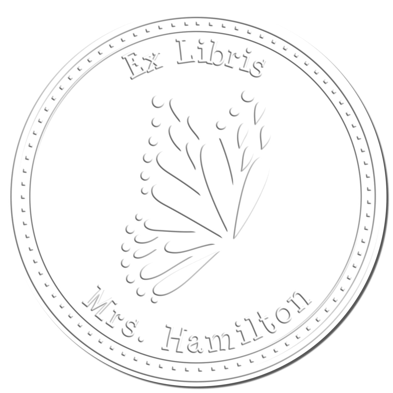 Gray circular embossed ex libris stamp seal with leaf motif and text Ex Libris Mrs. Hamilton.
