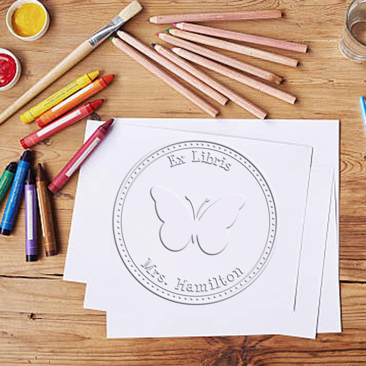Shiny Soft Colorful Butterfly animal embossing stamp in use, featuring detailed butterfly design on a rubber stamp for crafting.
