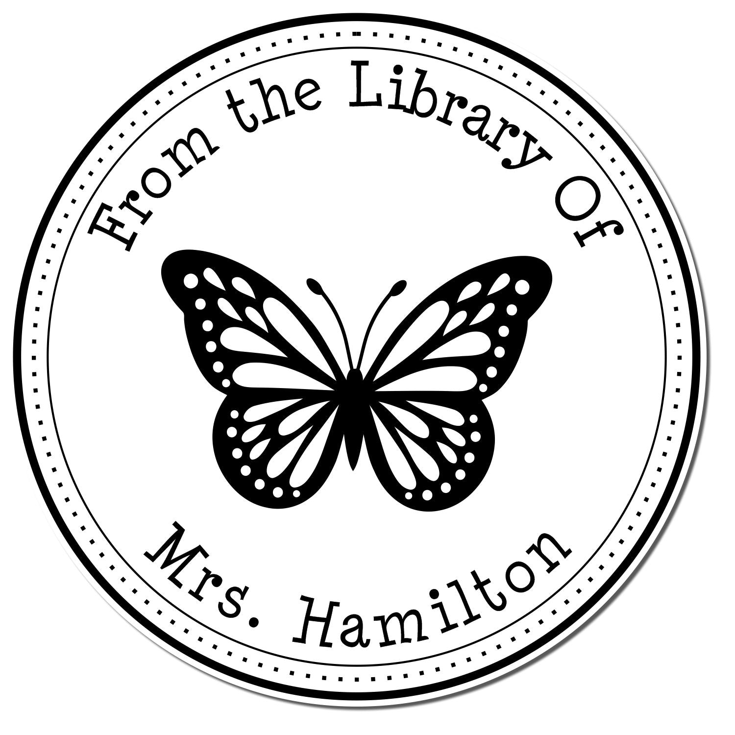 Black-and-white circular library stamp and seal with butterfly and From the Library Of Mrs. Hamilton text.